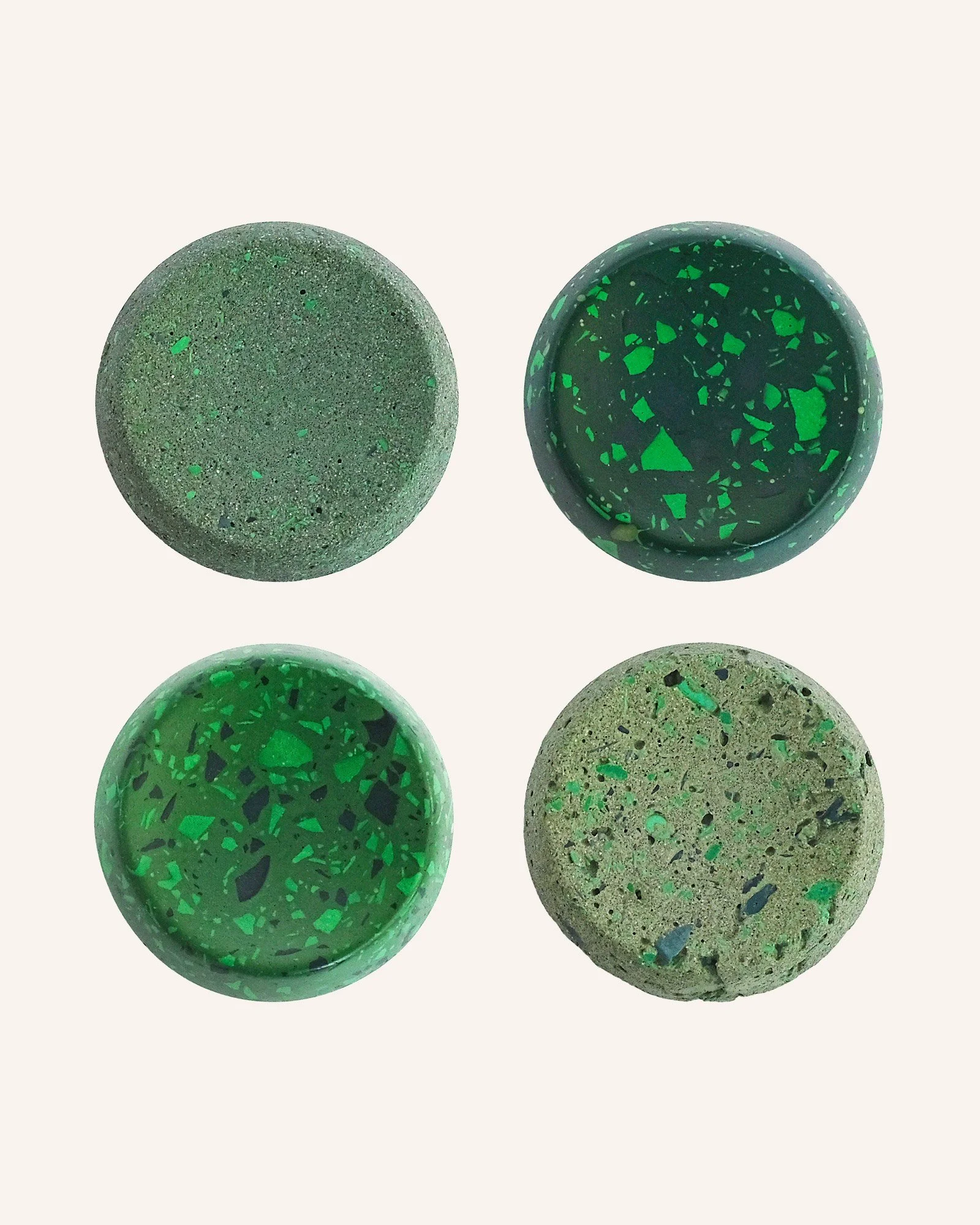 Collection of green terrazzo and stone basketball display stands, Edo Ball bases in multiple finishes for designer art basketball display.