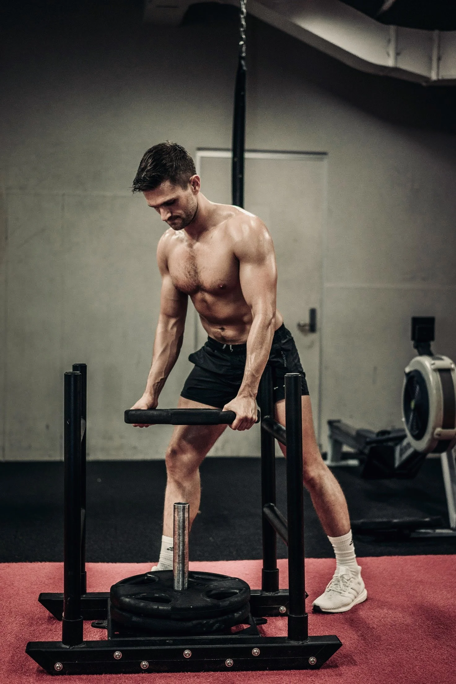 Caleb front pose showing his defined physique after FullForm coaching
