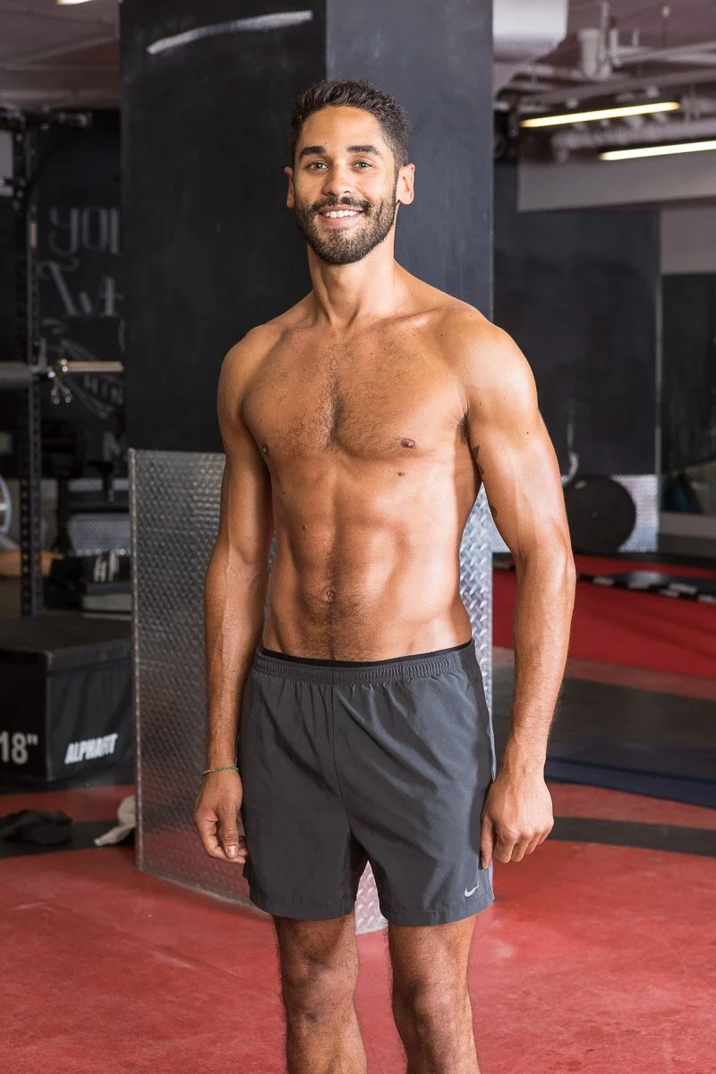 Bryan posing, showing the muscle he built from scratch with FullForm in Sydney
