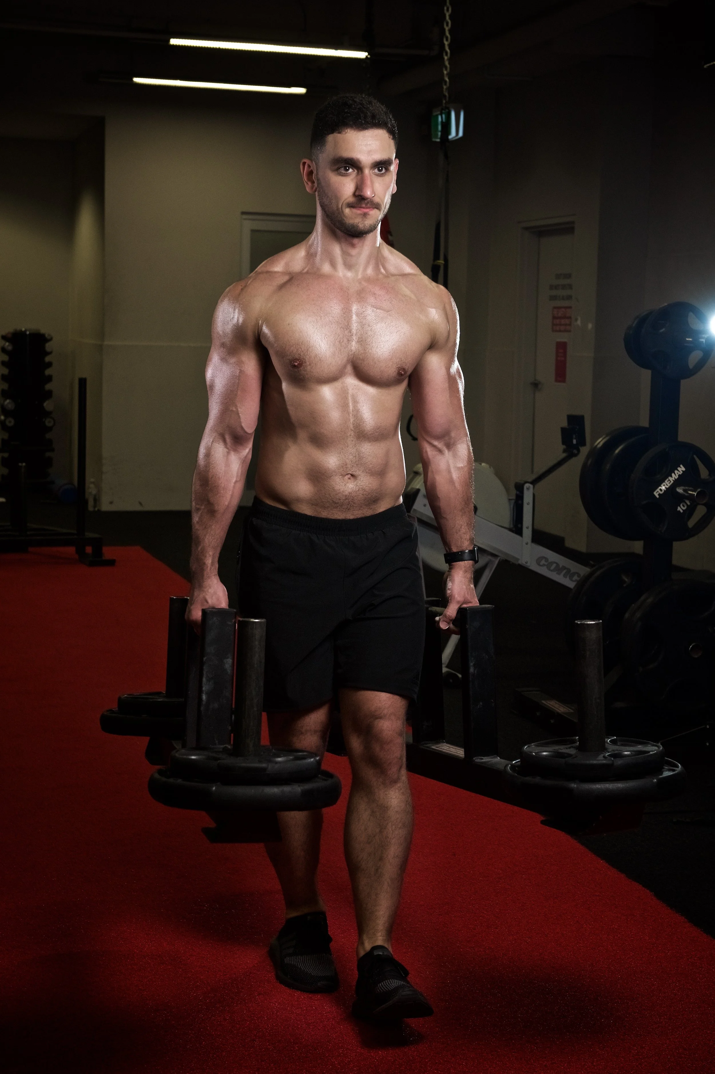 Renato body transformation — FullForm online coaching client carrying weights