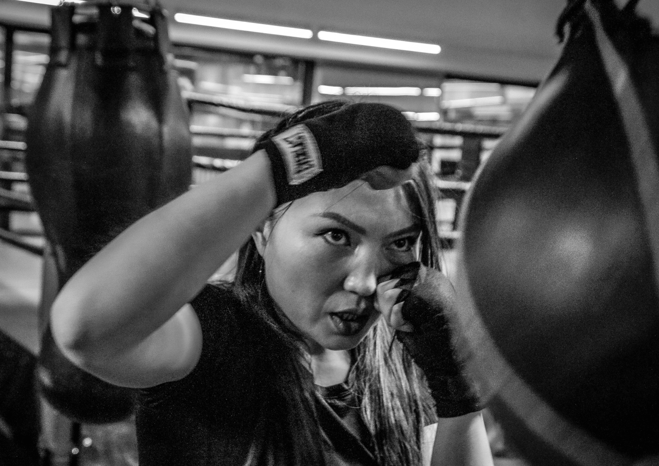A woman mid-fight stance representing the anger that occures with healing complex trauma in Farmington Hills, MI.