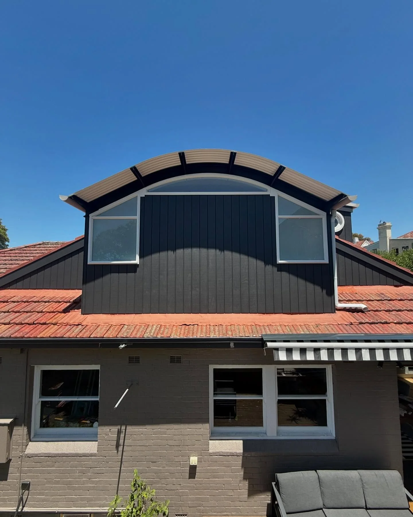 Our finished project at Croydon. This was an attic space extension with a curved colourbond roof and exposed structural steel beams with outriggers