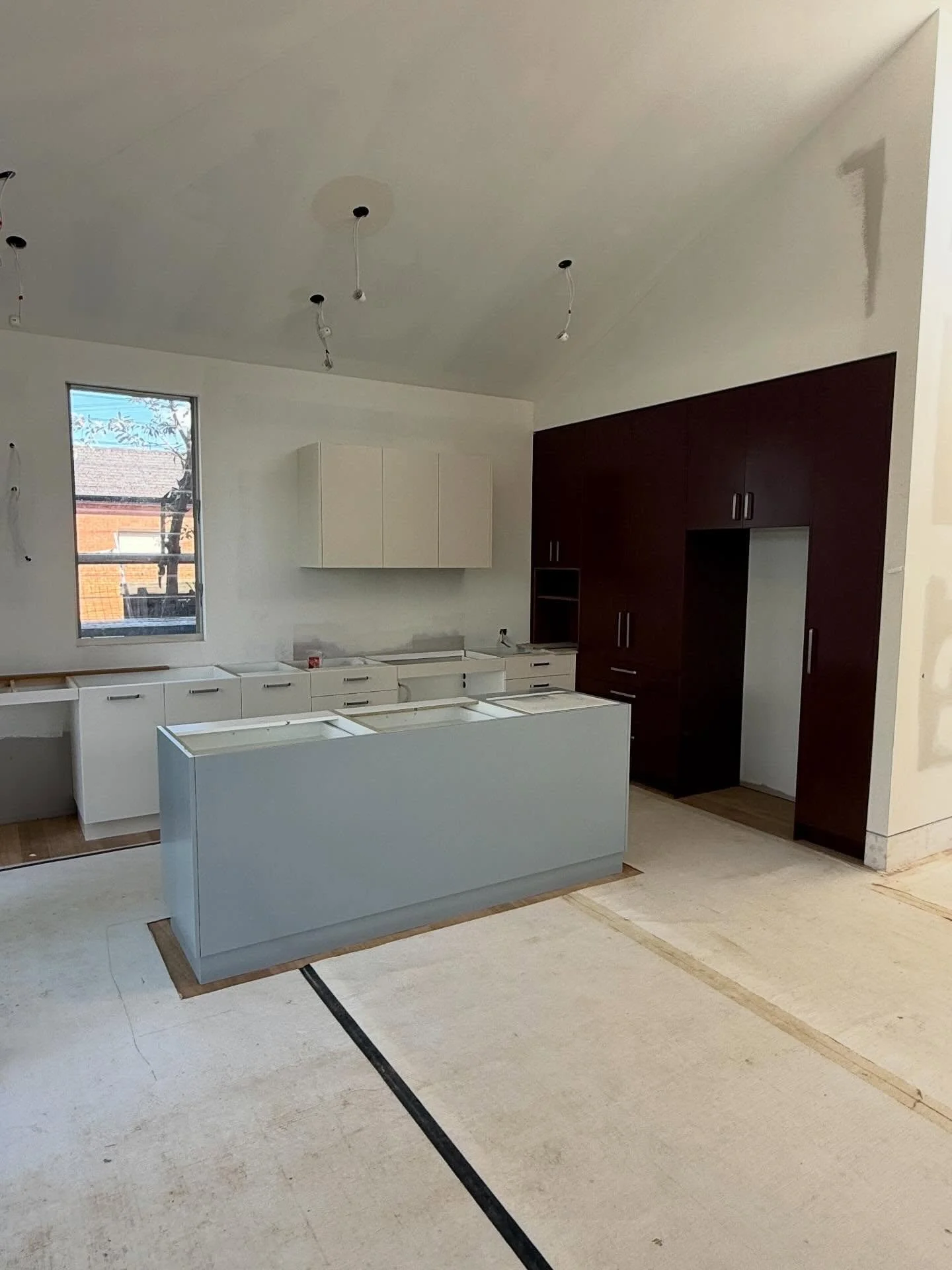 Progress photos of our Croydon project. Cabinetry has been installed in the kitchen and laundry, painting&rsquo;s begun and bathrooms have been tiled