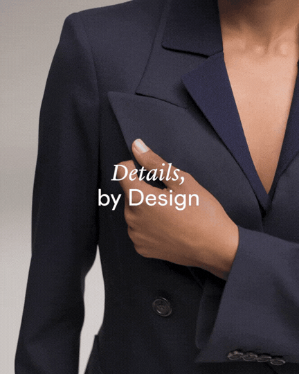 Close-up of a woman in a navy blazer with the words 'Details, by Design' overlayed.
