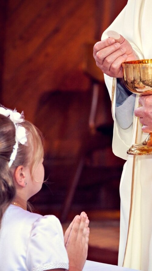First Communion — Holy Family Catholic Church