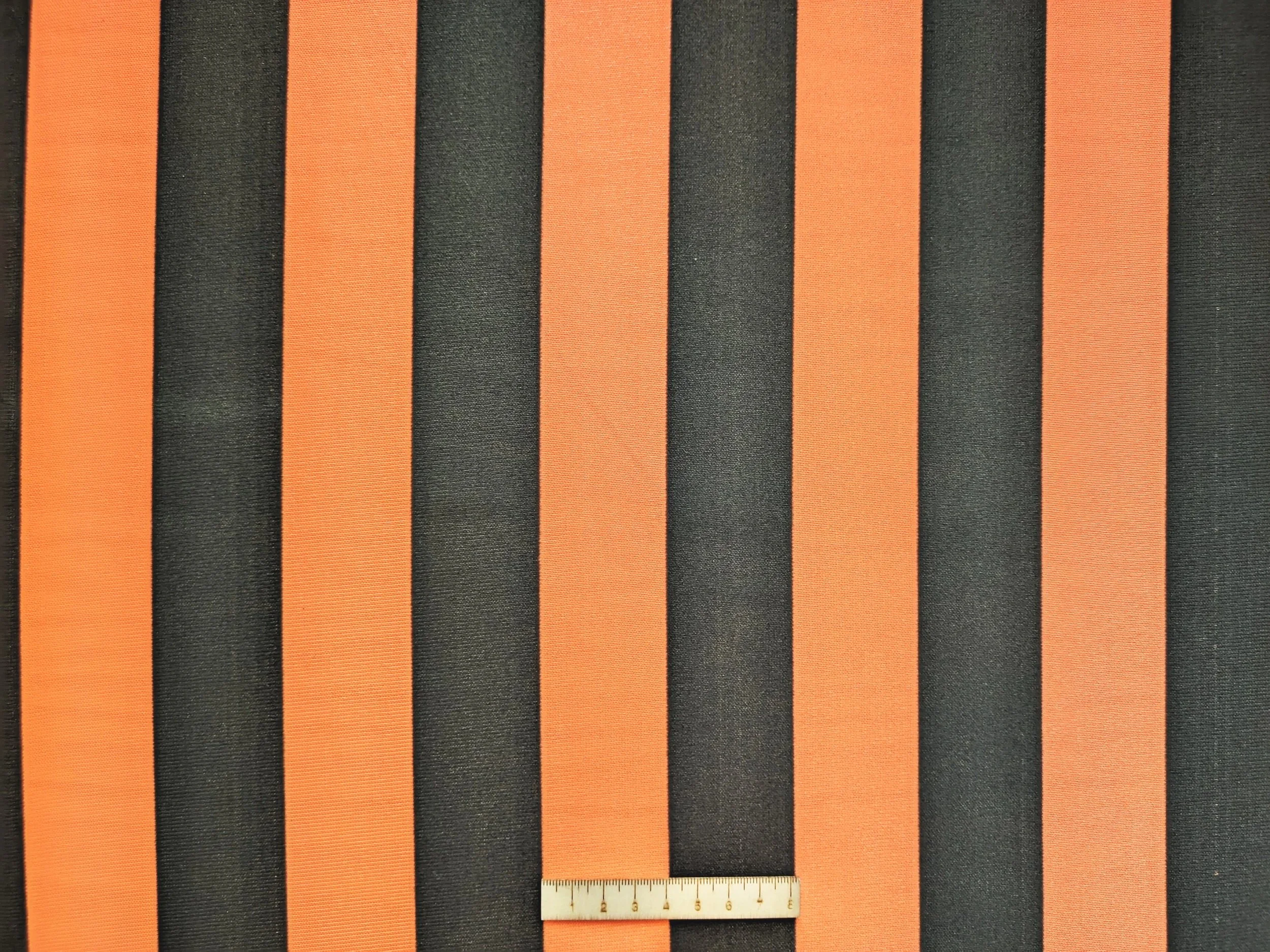 RAYA NEGRA Y NARANJA FLUOR ANCHA