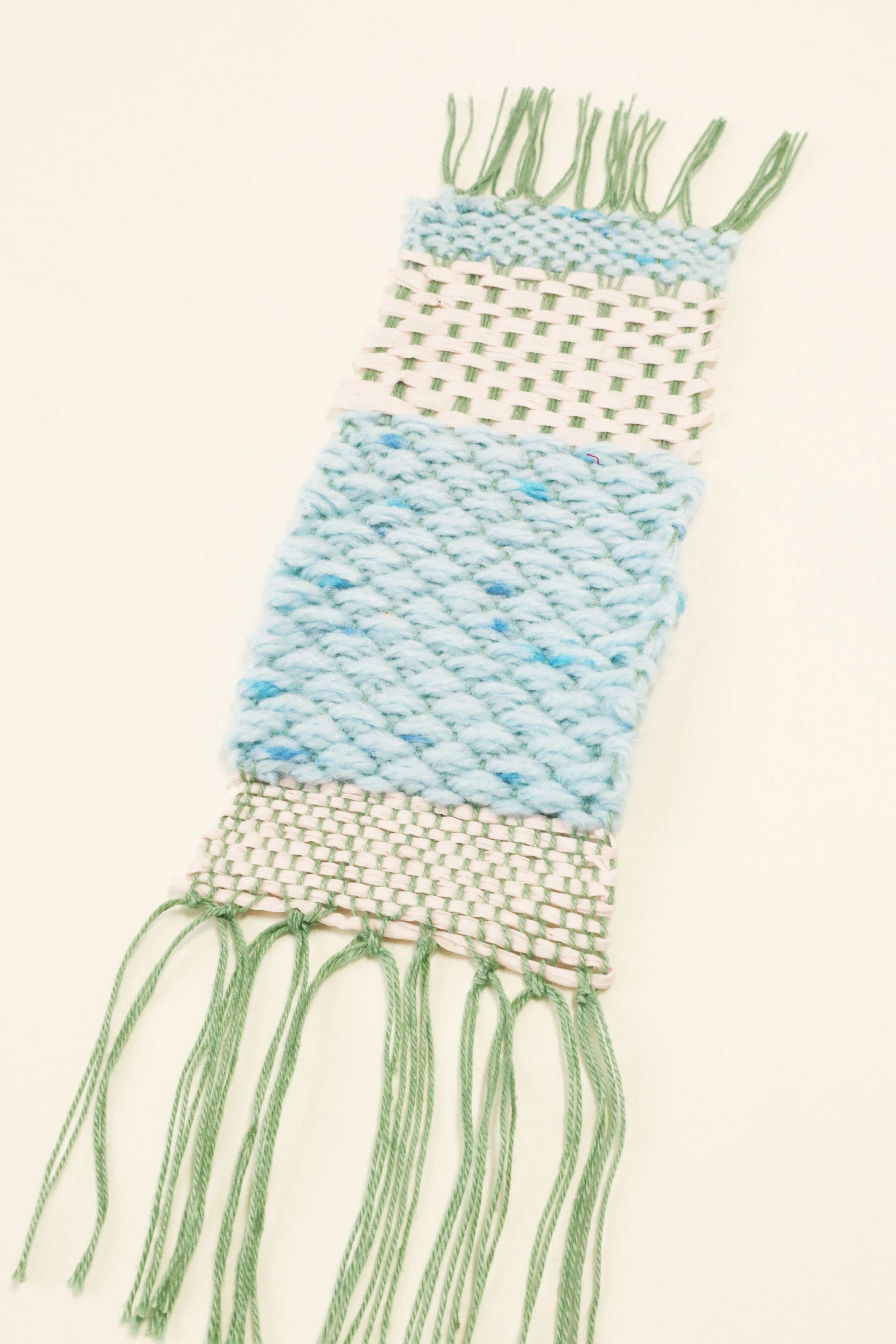 Pale blue and pink woven bookmark