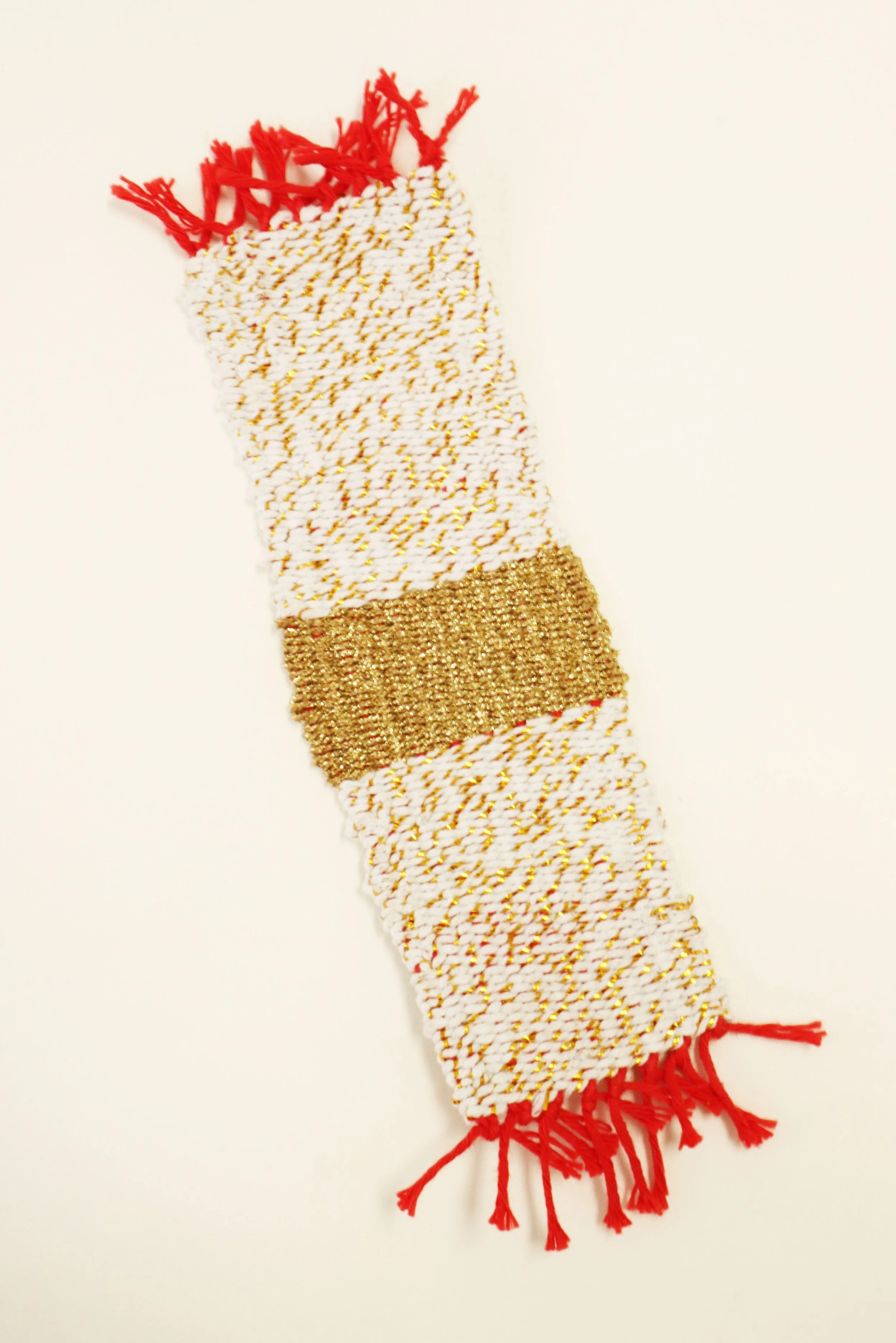 Gold and white woven bookmark