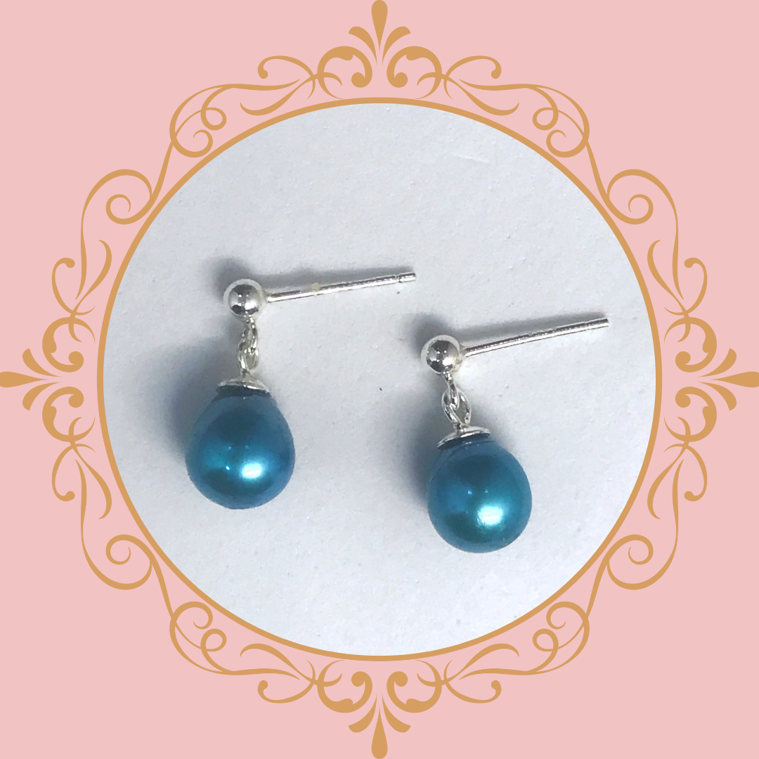 teal pearl earrings on stud earrings.png