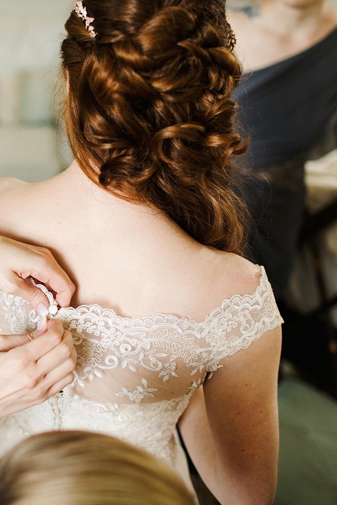 Bride Getting Zipped Up by Maid of Honor Detail