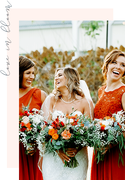 Smiling Bride and Two Bridesmaids with Bouquets Outside