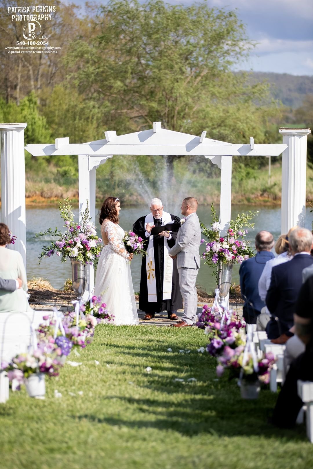 Sinkland-Farms-event-wedding-venue_bride-groom-outdoor-wedding-ceremony-beside-tuscan-pond-blue-ridge-mountains-backdrop-copy.jpeg