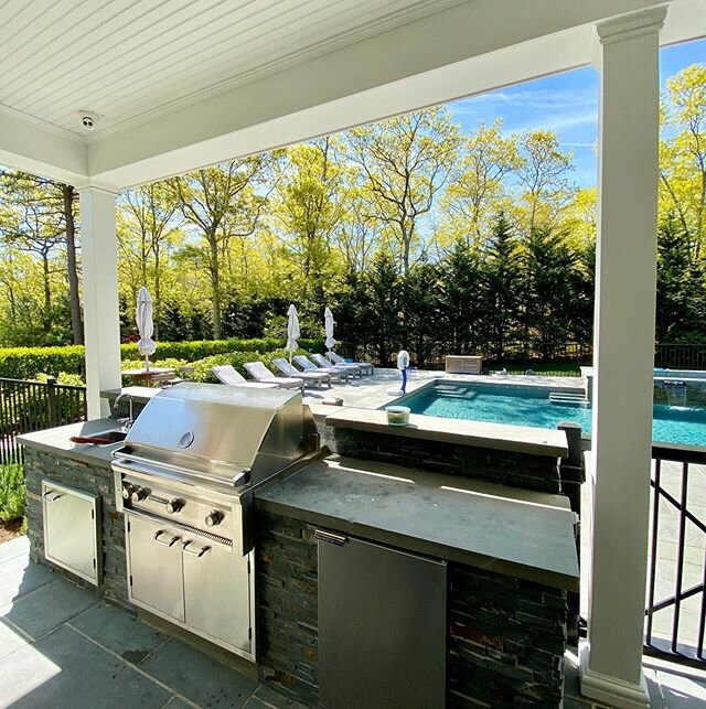 We love creating beautiful spaces for our clients to entertain, relax, and enjoy their outdoor space to the max. #outdoorliving #outdoorkitchen #outdoorkitchendesign #poolsofinstagram #masonry #stonework #fencing #evergreenhedge #landscapedesign #lan