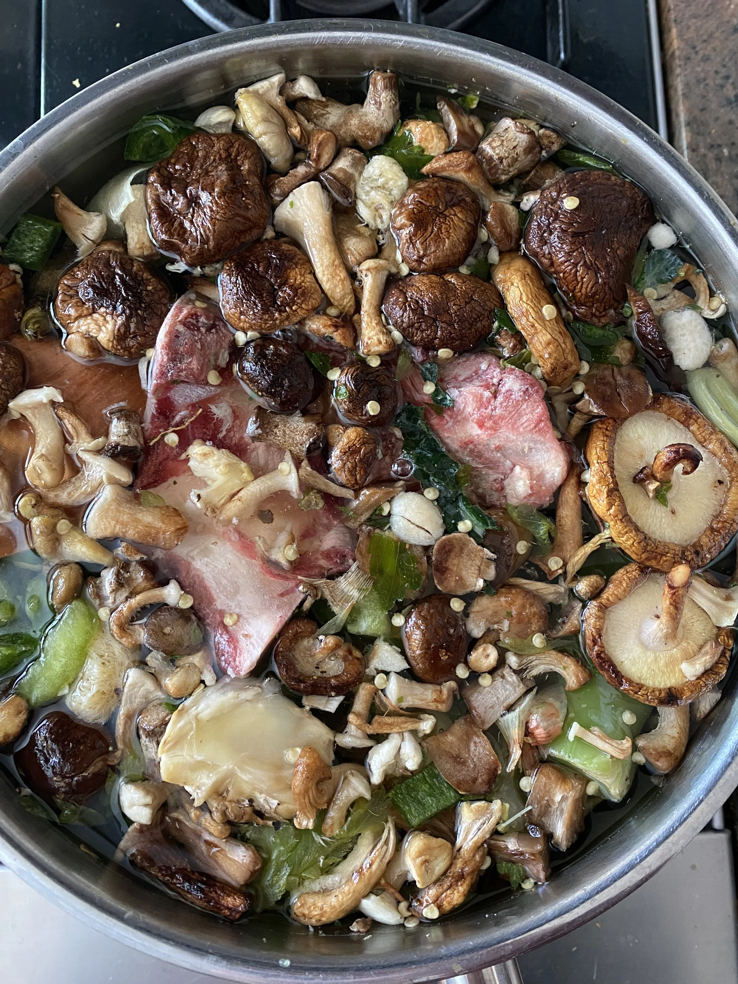 Mixed fungi and vegetables cooking in a pan. Private Chef in Aspen Colorado Roaring fork valley 