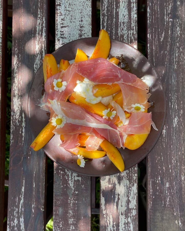 peaches / burrata / prosciutto di Parma / neighbor&rsquo;s chamomile flowers &amp; @oracleoliveoil &mdash; best eaten in the garden. x