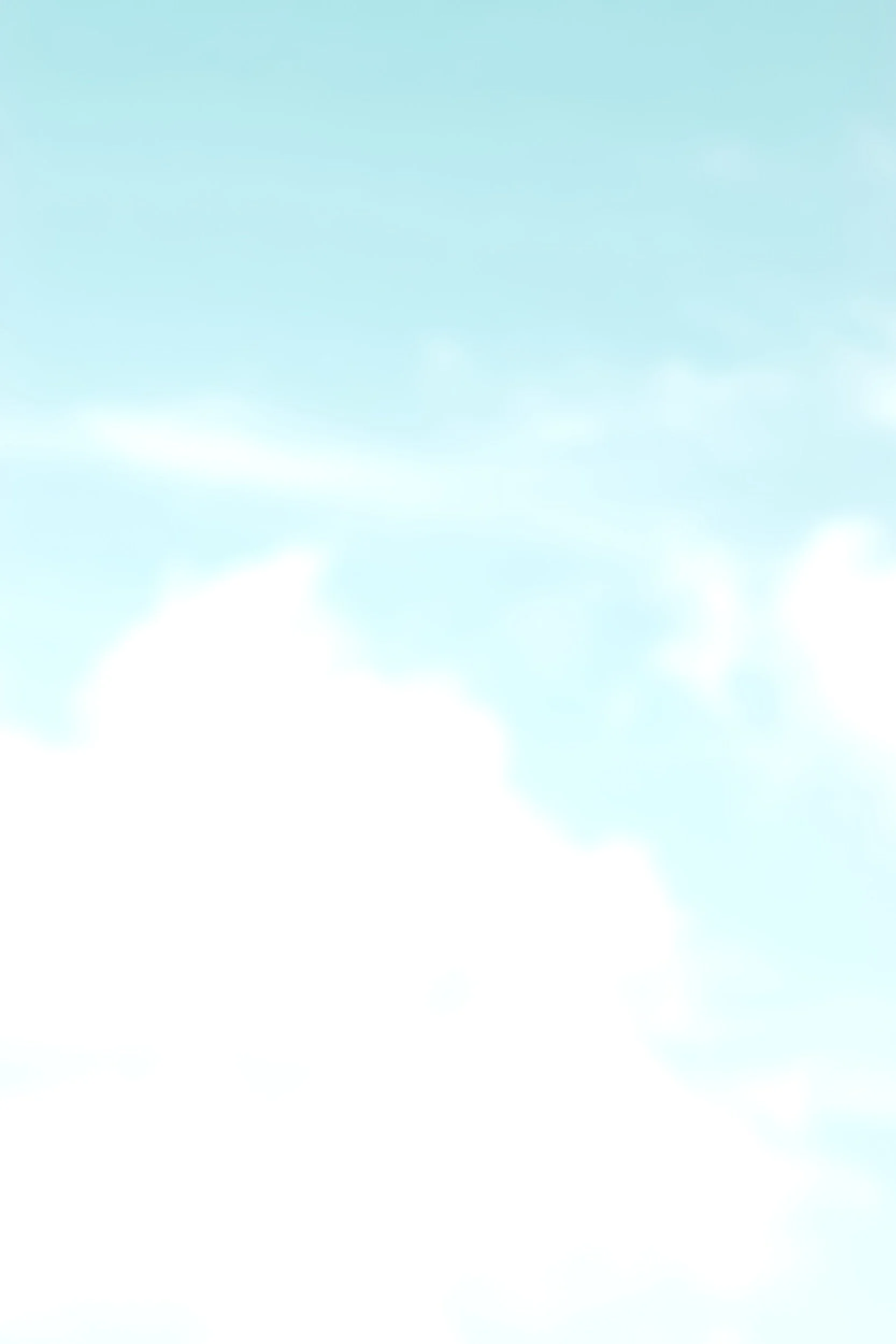 Blue sky with a few scattered clouds.