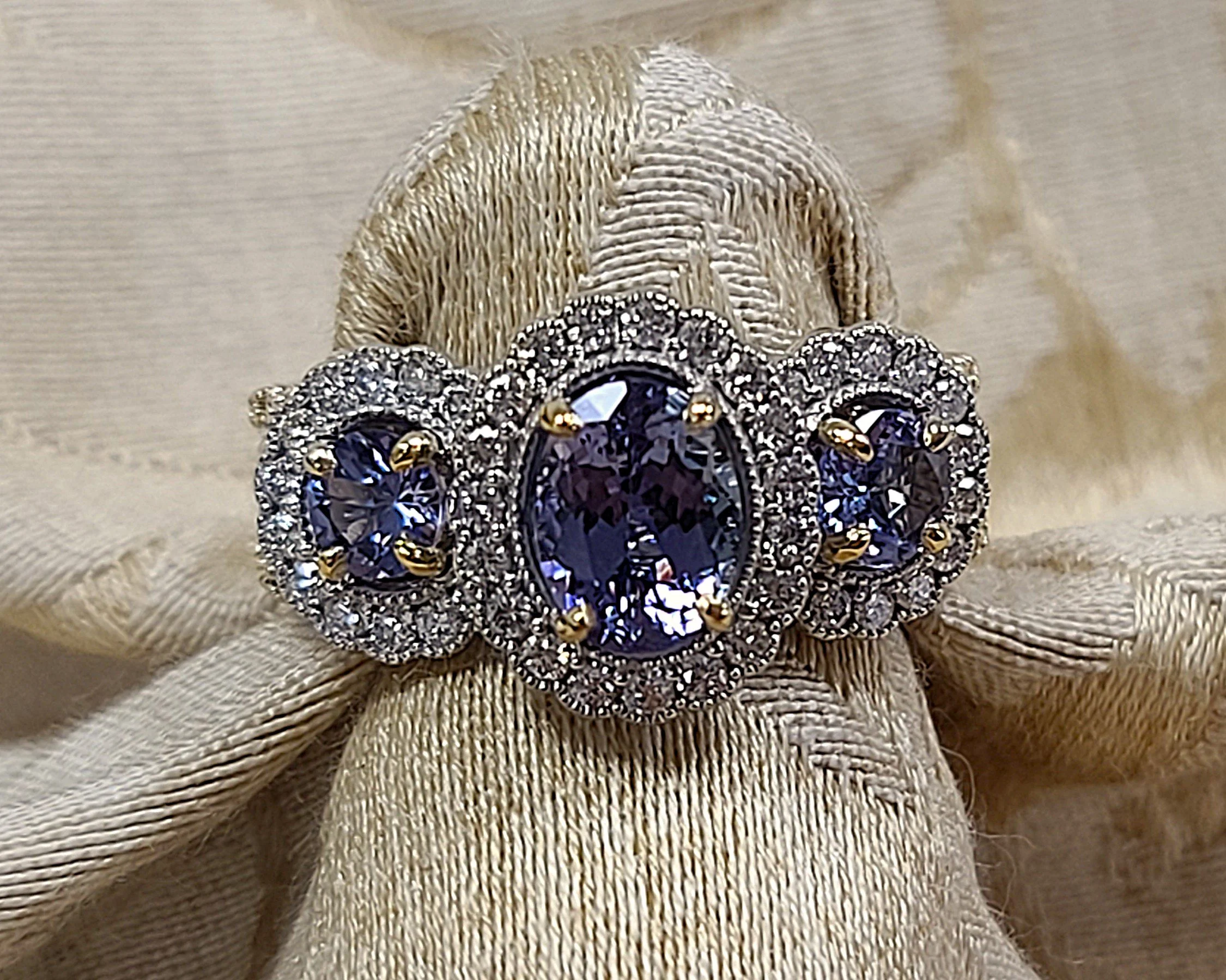 Tanzanite triple halo ring