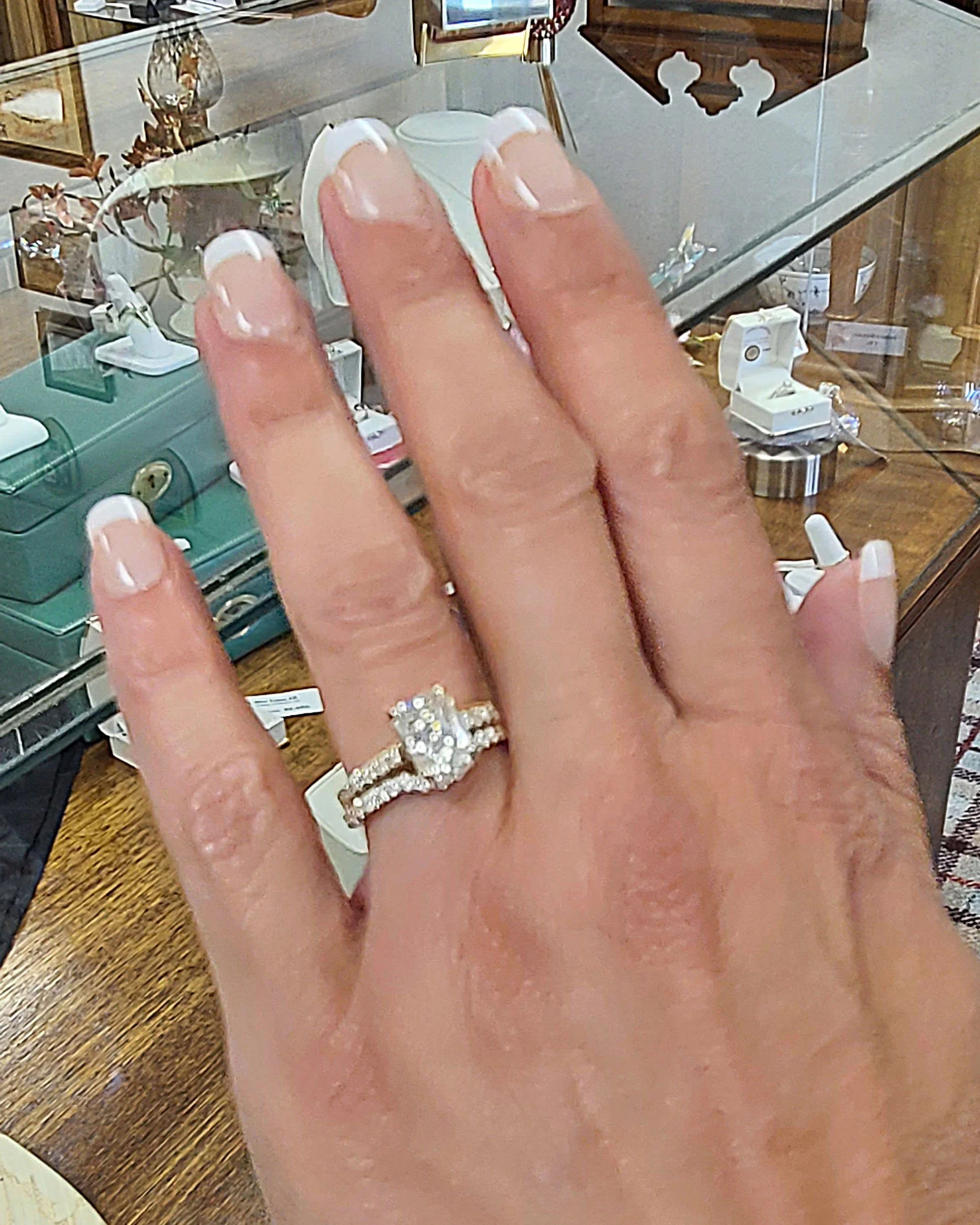 Radiant cut eternity wedding set on hand