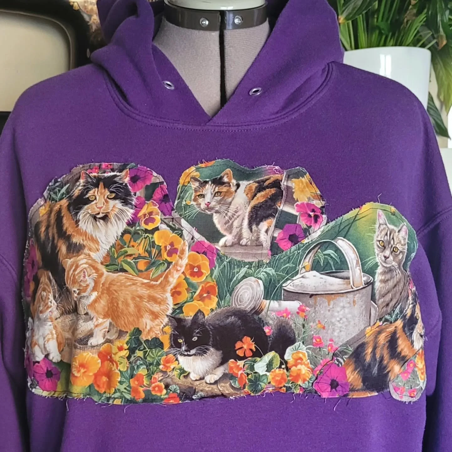 Definition - Upcycle: to reuse (discarded objects or material) in such a way as to create a product of higher quality or value than the original.

I'm pretty sure adding cats to anything always adds value to any piece of clothing. 🐈🐈&zwj;⬛

I don't