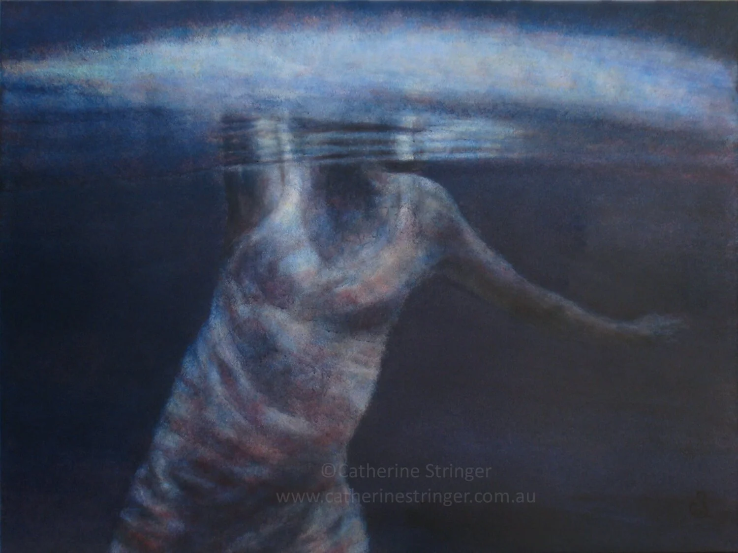 woman underwater with head and waving arm above
