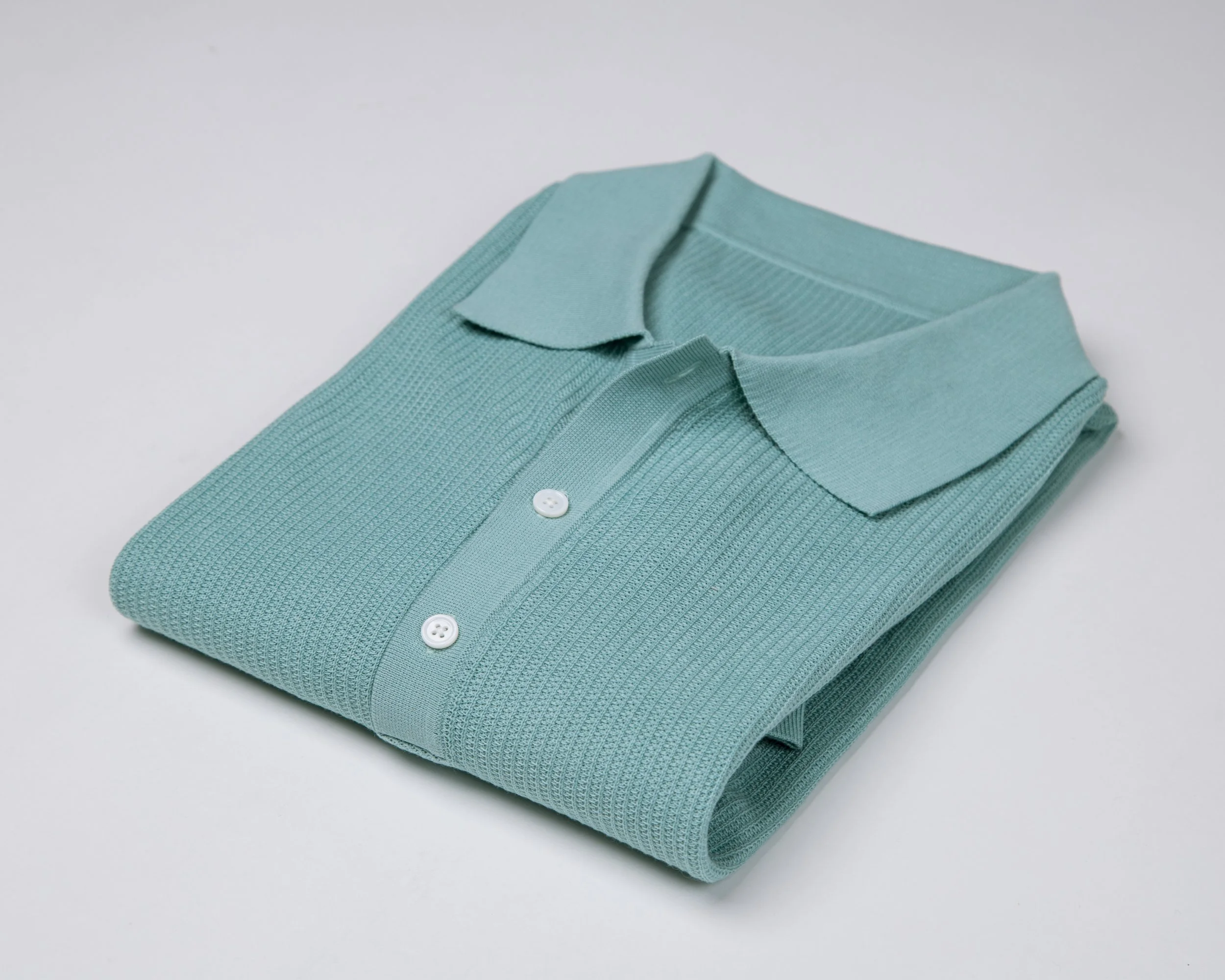Not your standard tennis polo — it’s better. Knitted, all cotton &amp; perfect under a suit or blazer