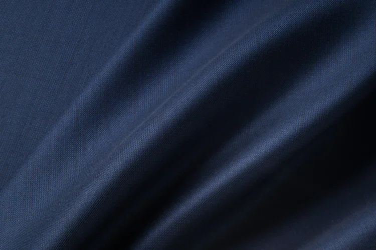 Navy worsted wool fabric in soft folds