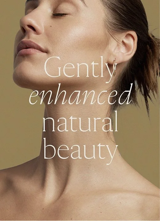 A head and shoulders picture of a beautiful woman with minimal makeup. with an overlay of the words Gently Enhanced Natural Beauty