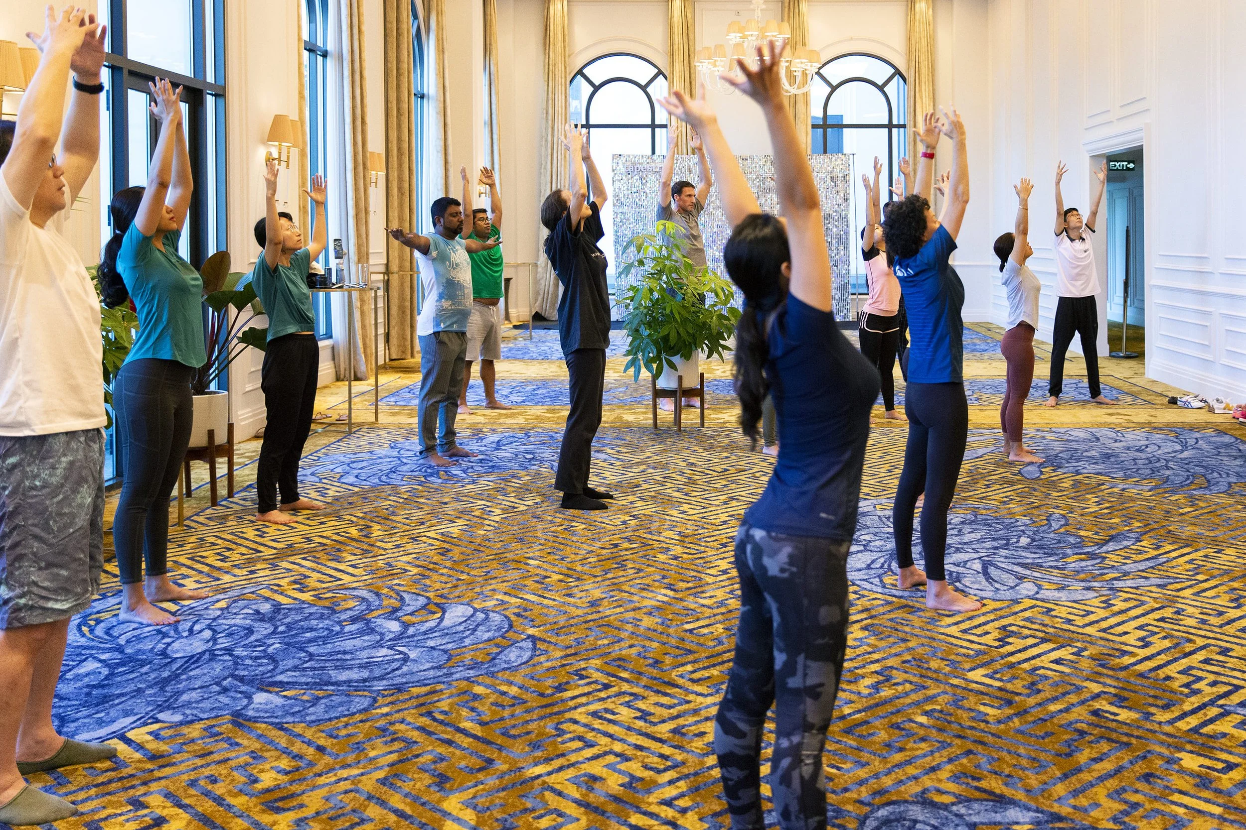 Ani Petrova leading a Taoist Qi Gong session before a corporate wellness conference.