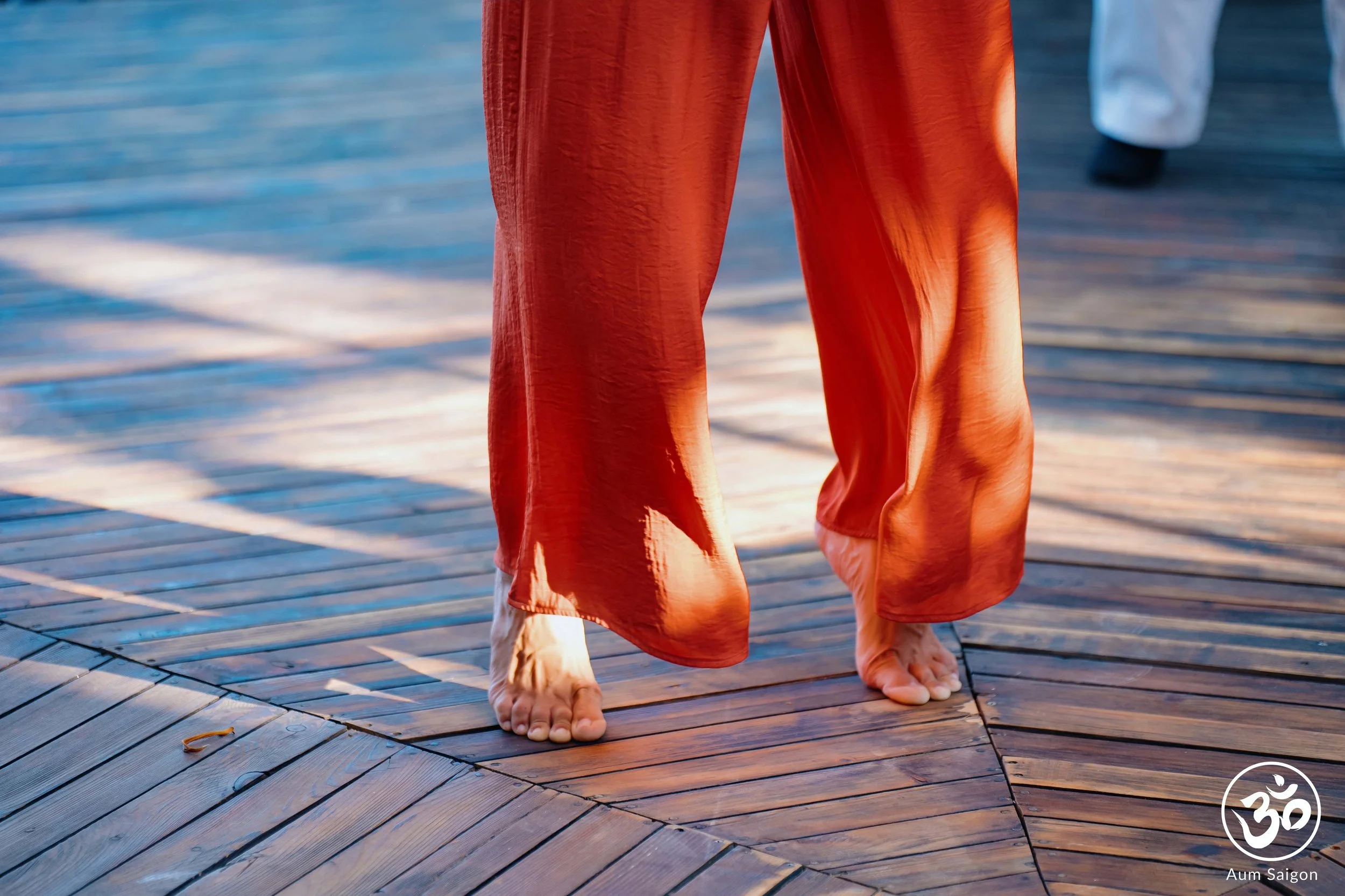Barefoot grounding during Taoist Qi Gong practice, emphasizing balance, stability and connection with the earth.