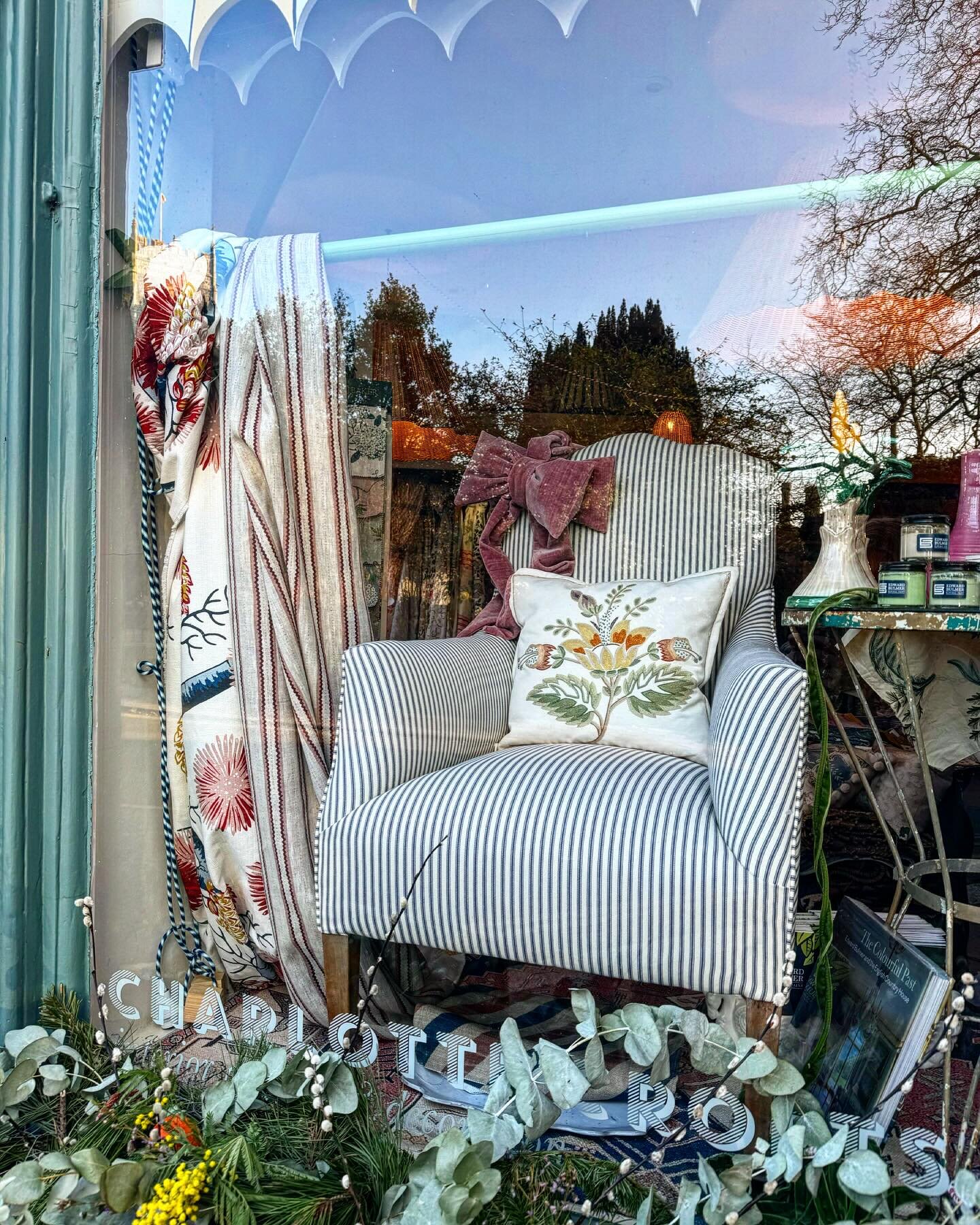 This beautiful turn of the century chair has just arrived, reupholstered in French airforce blue mattress ticking, looking very pretty with the mimosa from the market at the window and the hand embroidered cushion from @chelseatextiles 💕 #charlottec