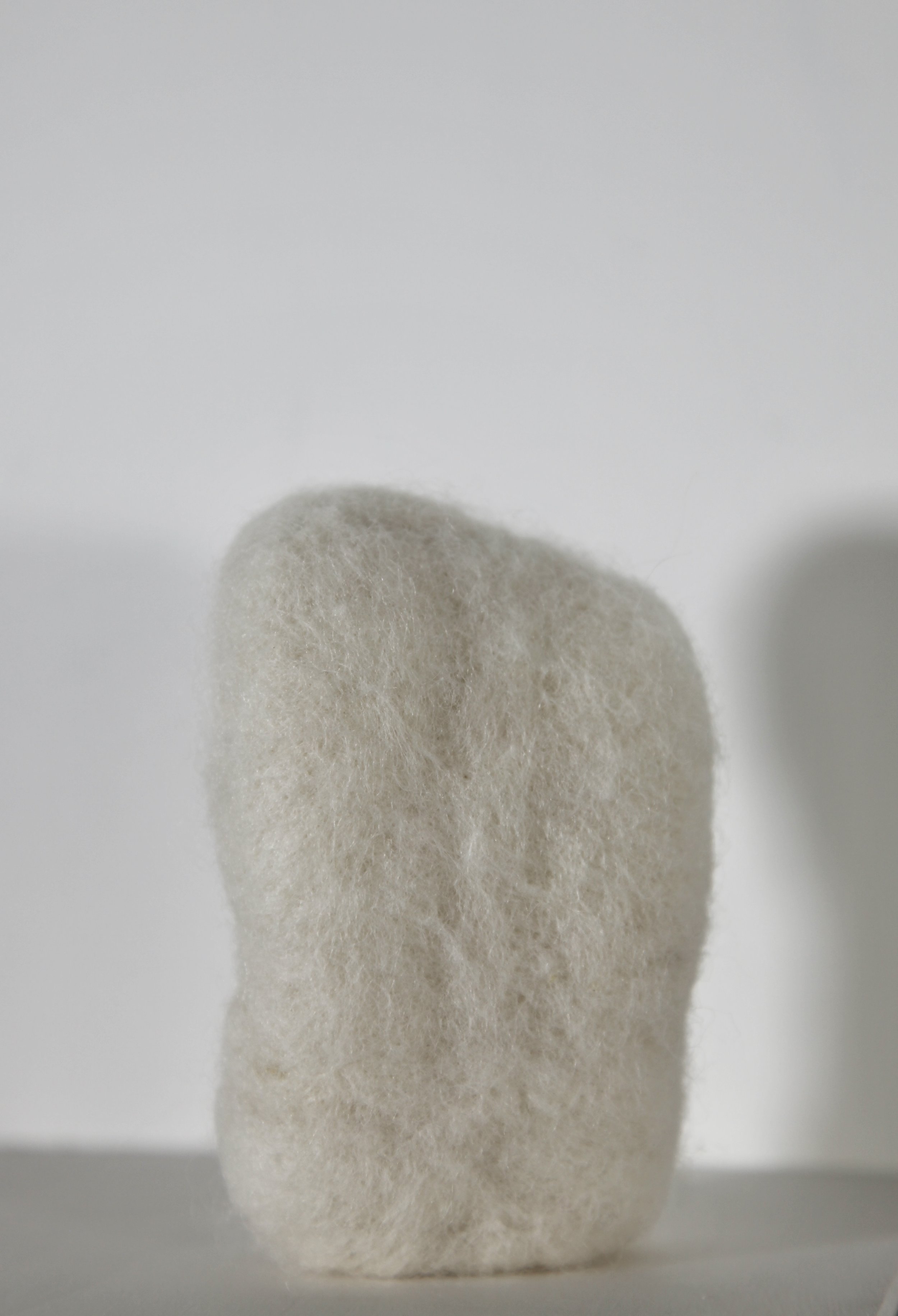   Seed,  2023, felted wool and pebble, 12 x 8cm 