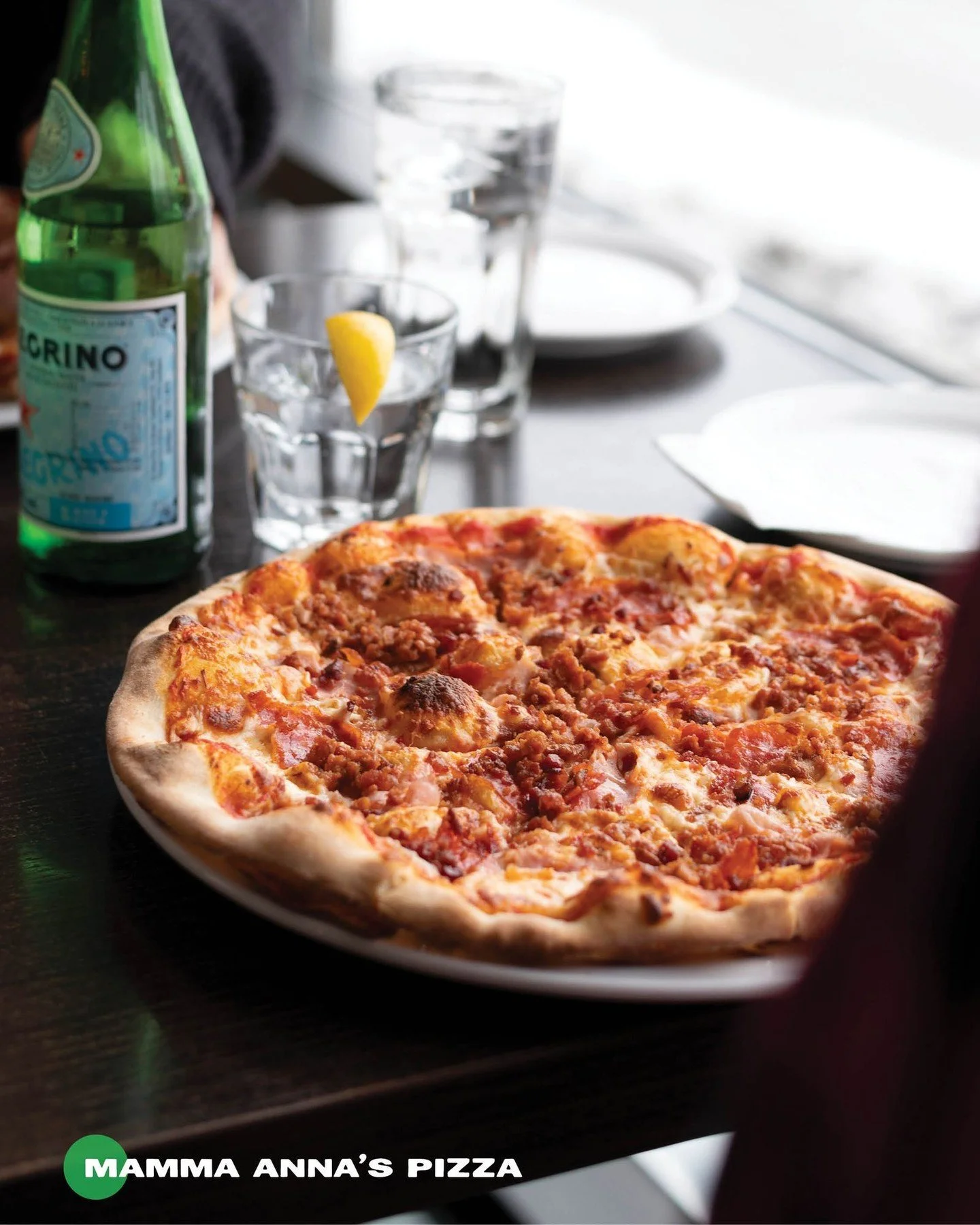 Nonna Annie makes our signature Mamma Anna&rsquo;s Pizza with our delicious house-made tomato sauce, melty mozzarella cheese, spicy Italian sausage, rich salami, tender ham and crispy bacon on a perfectly authentic thin crust. 

Each bite carries the
