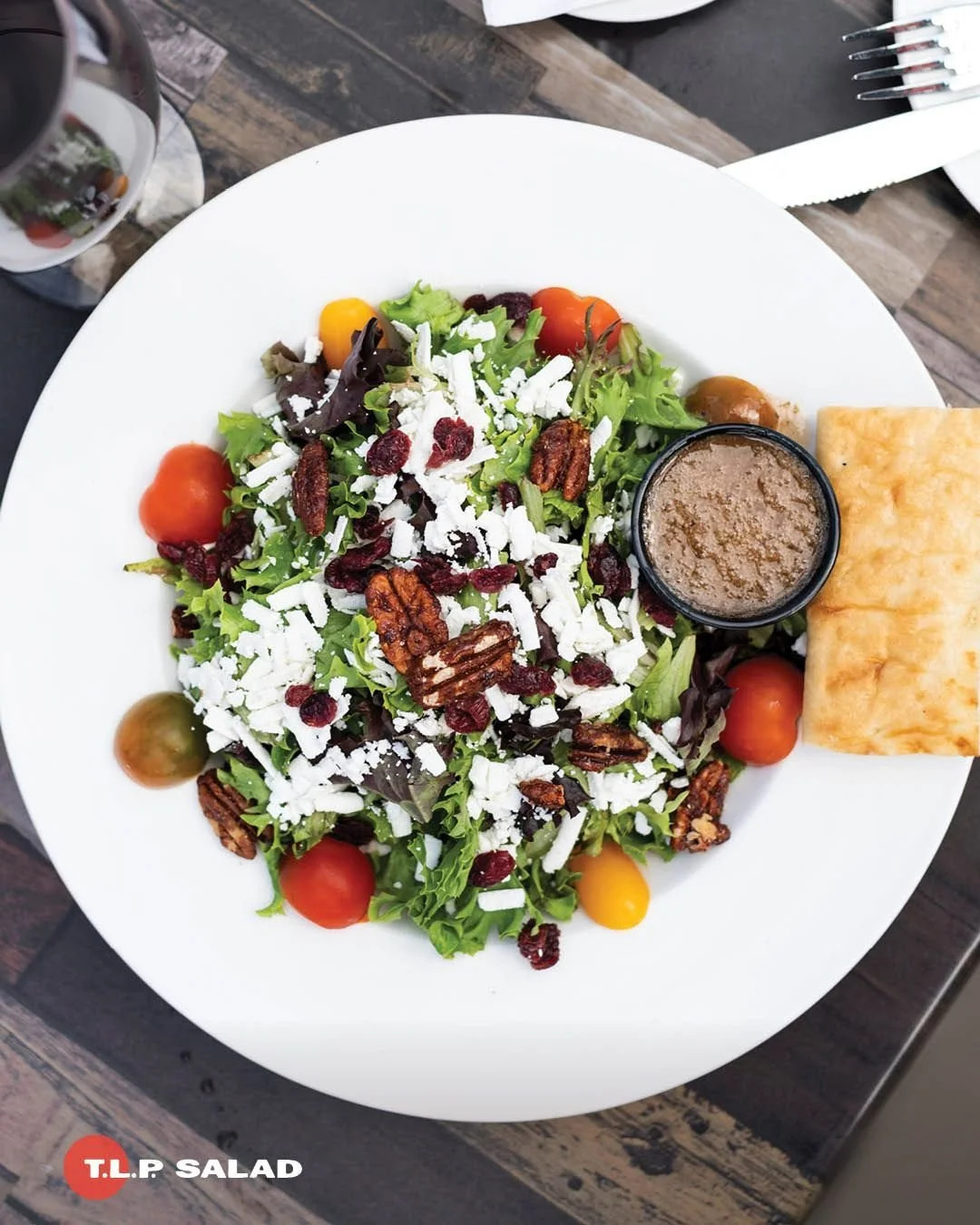 🥗 A salad so good, we named it after the restaurant!

Fresh greens, juicy tomatoes, sweet candied pecans, cranberries, feta, and our signature T.L.P. salad dressing come together into a delightful salad that&rsquo;s great as a side to your favourite