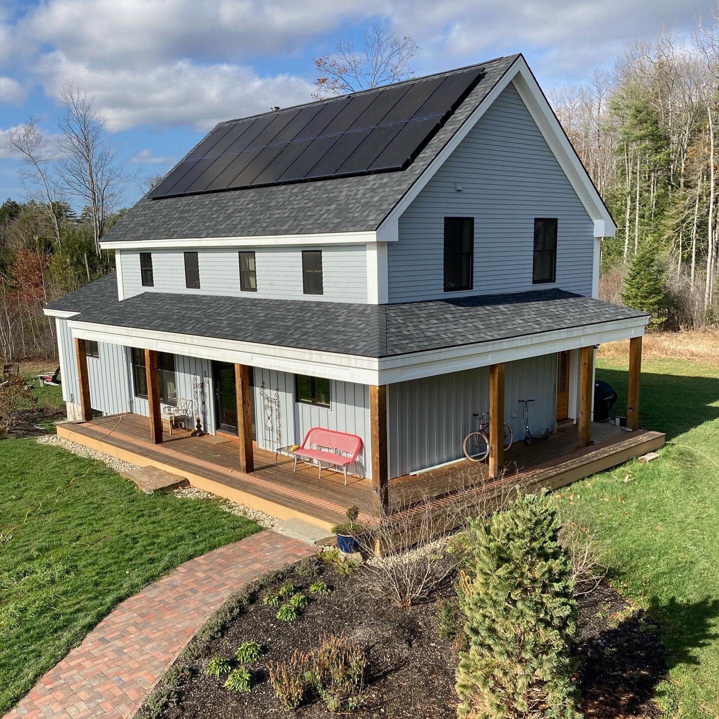 Slate farmhouse from the second floor of the party barn! Each house in this solar neighborhood is unique and different, yet built off the same original block and turned or manipulated to faith that site and owners needs. #solarway #livemaine #maine #