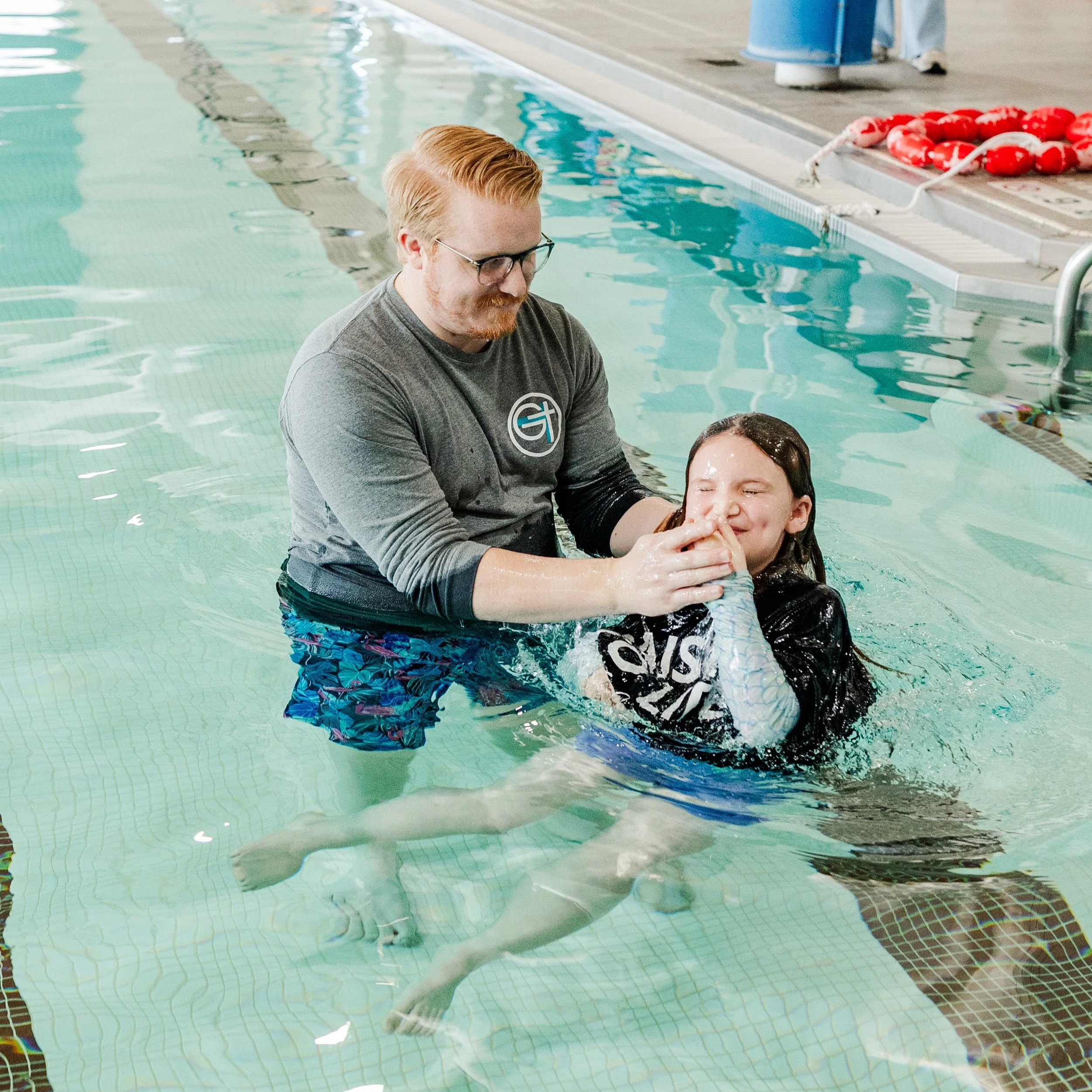 Baptism of a young girl at the YMCA in Henry County
