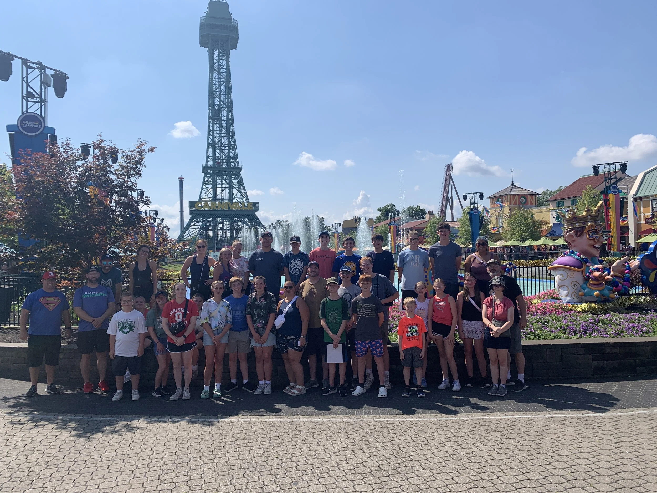 Students and leaders in a group photo at Kings Island amusement park. 