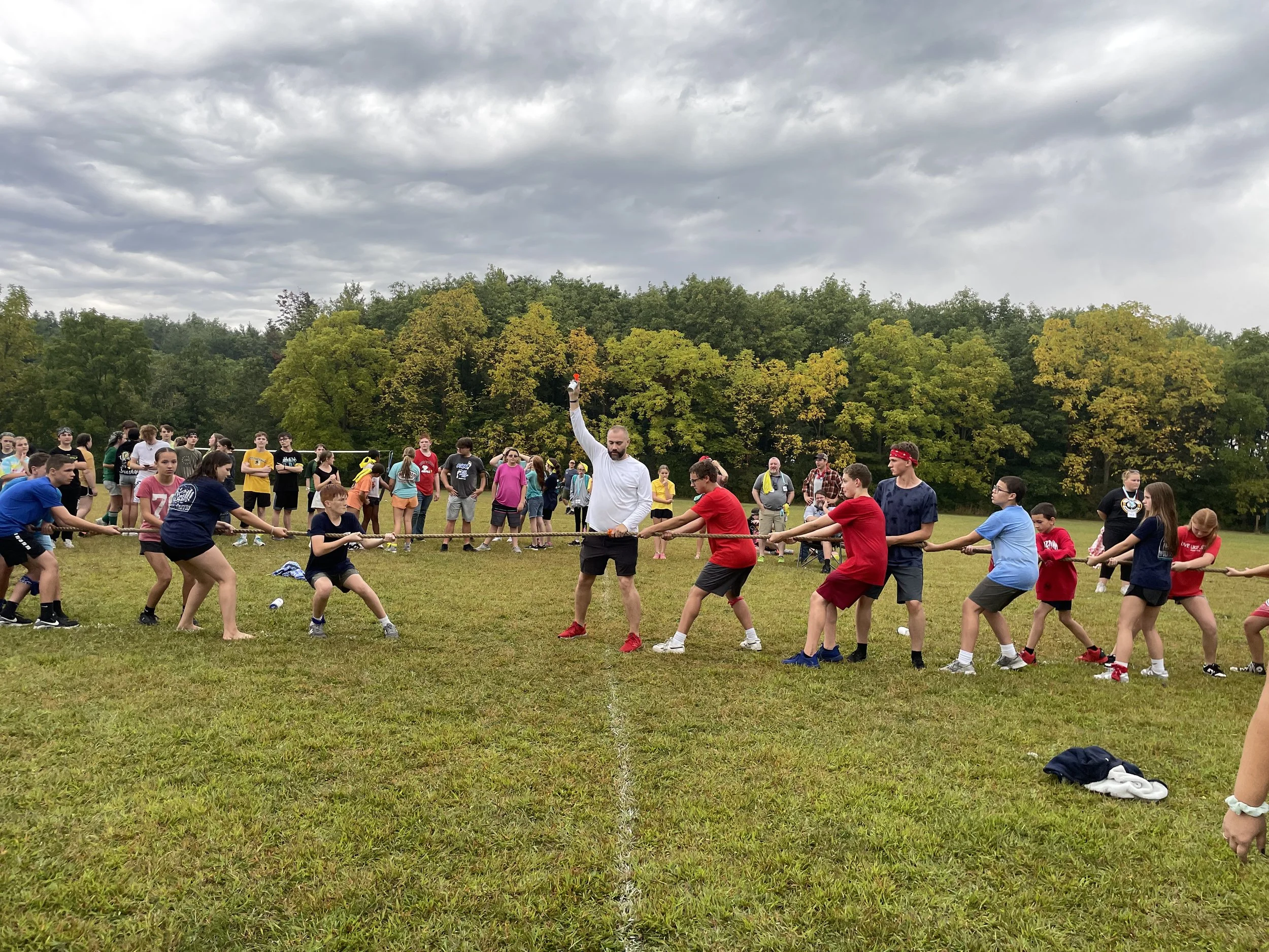 Students and Youth prepare for a game of tug-of-war at camp. 