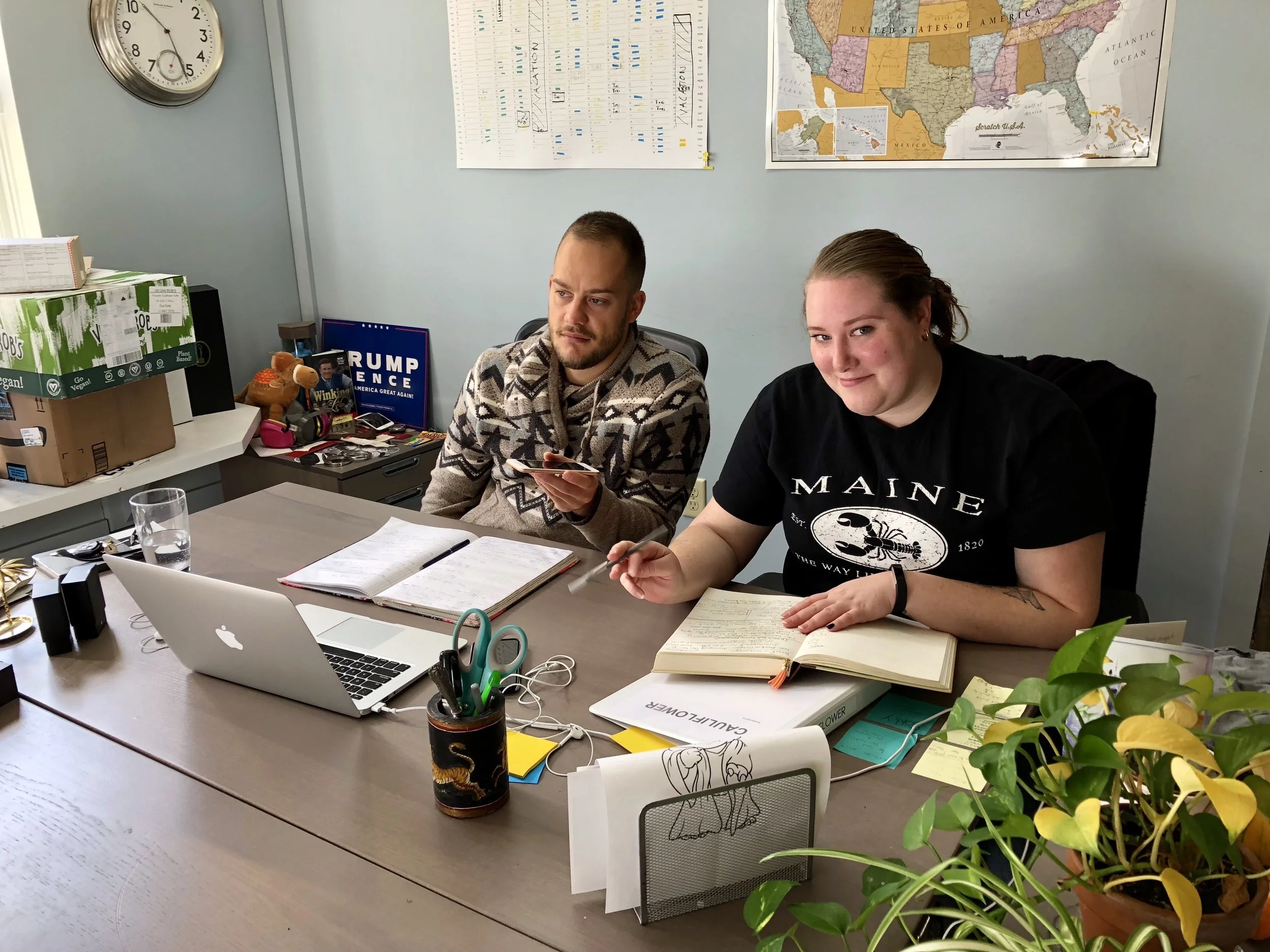 One of our producers and our production assistant is working on putting the production schedule together and one of the desks in the office