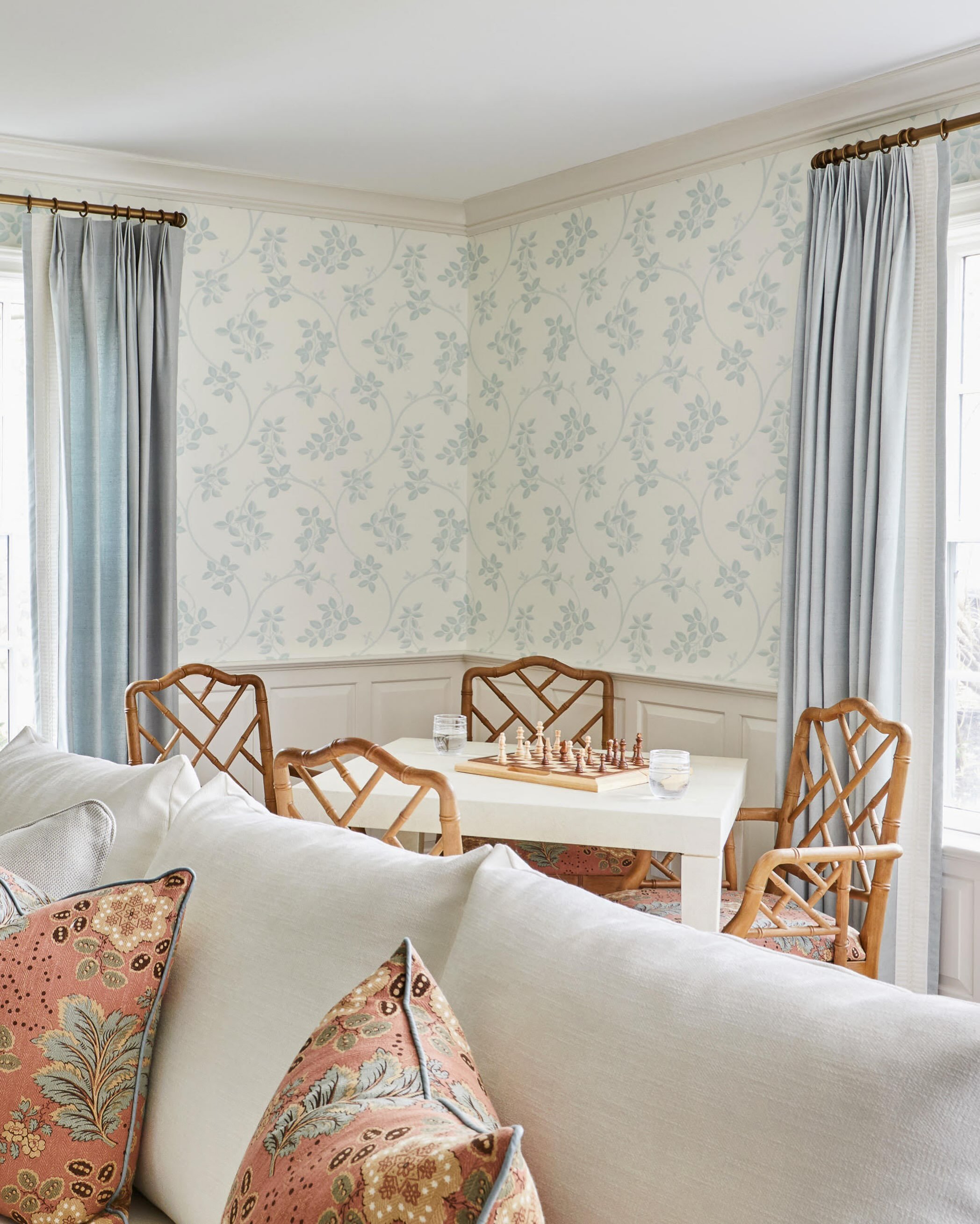 Proof that a game table can be as much a design moment as a dining one &mdash; bamboo chairs, a soft blue wallpaper, and a board ready for play. 🩵

#anniedelaportedesigns #ctinteriordesign #gameroom #wallpaper #coastaldecor