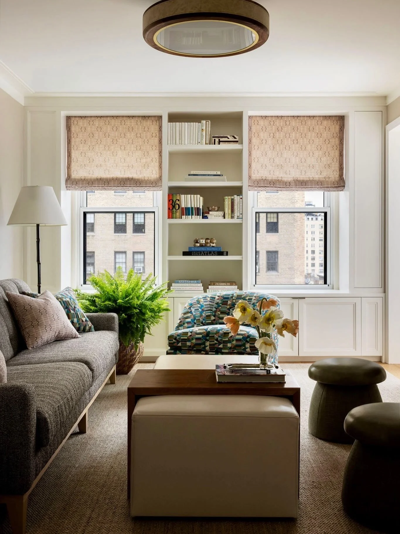Layered, lived in, and loved. Whether it&rsquo;s a quiet moment with a good book or family movie night, this Carnegie Hill space was designed for it. 📖