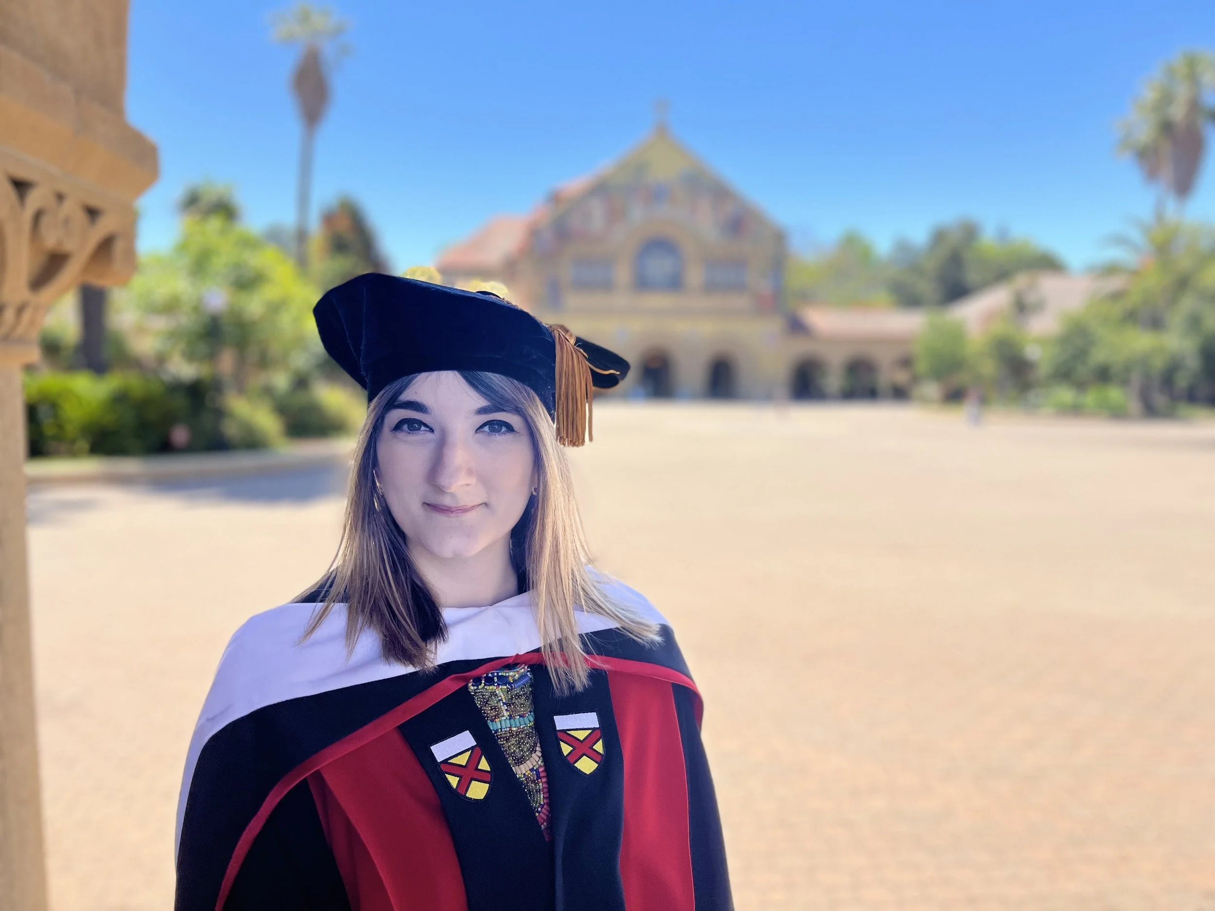 An image of Gabriela Badica standing in Stanford University's Main Quad.