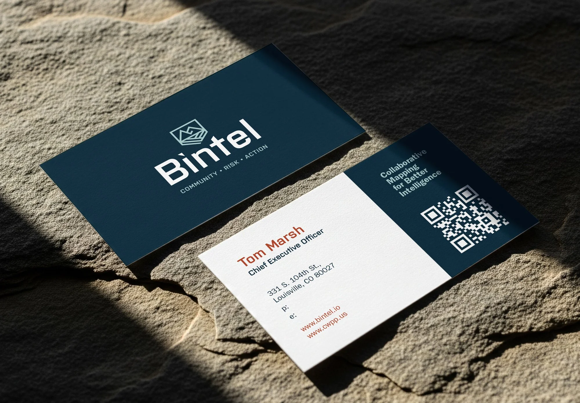 Business cards arranged on a textured surface, showing a cohesive small business visual identity
