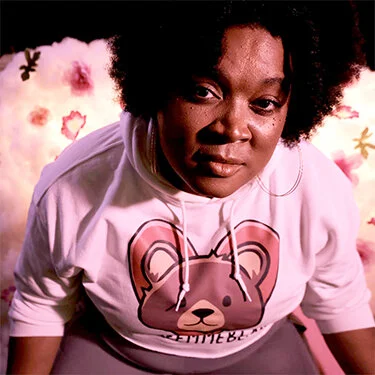 LeahAnn “Lafemmebear” Mitchell is an independent music producer, sound engineer, and artist whose words and work have been featured in The Guardian, GLAAD, Queerty, Out.Tv Euro, Autostraddle, Billboard, and MTV. She has collaborated with Alice Sheppard and Disability Danceworks on their piece WIRED, as well as with PEG Records to co-write and produce the first mainstream Pop-R&B single “What You’re Looking For” for Peppermint of Rupaul's Drag Race fame.  She produced, arranged, and sang on a new version of Sounds of Blackness's "Optimistic" with Peppermint and Mila Jam in honor of Transgender Day of Remembrance 2020.   Lafemmebear’s latest project “My Blaq Feels” is available on Bandcamp, and premiered live at Stanford University’s Black Love 2021 concert, where she opened for Chika.  Additionally, she produced three tracks on Def Sound's new album HUEM_N, also available on Bandcamp.  Def Sound and Lafemmebear’s collaborative single “2Much” is currently a featured part of The Black Index, an exhibit curated by Bridget R. Cooks. She is honored to be a part of such a beautiful creative community, and hopes the seeds she sows in her art will bear fruit to feed everyone.  