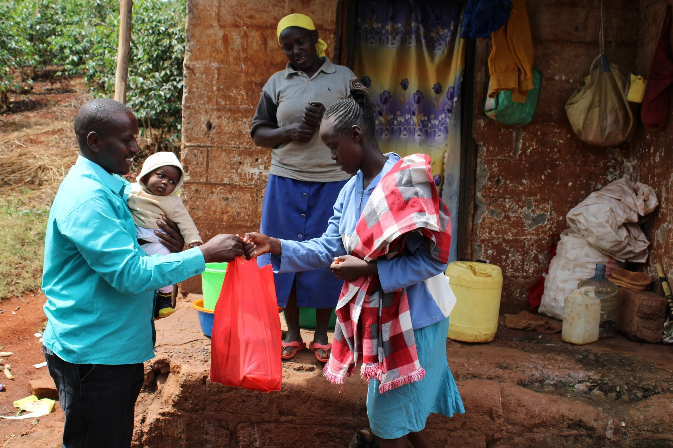 Pastor Robert is delivering a monthly food package to a young mother, Hannah, who lives with her mother. They were both abandoned by their husbands.