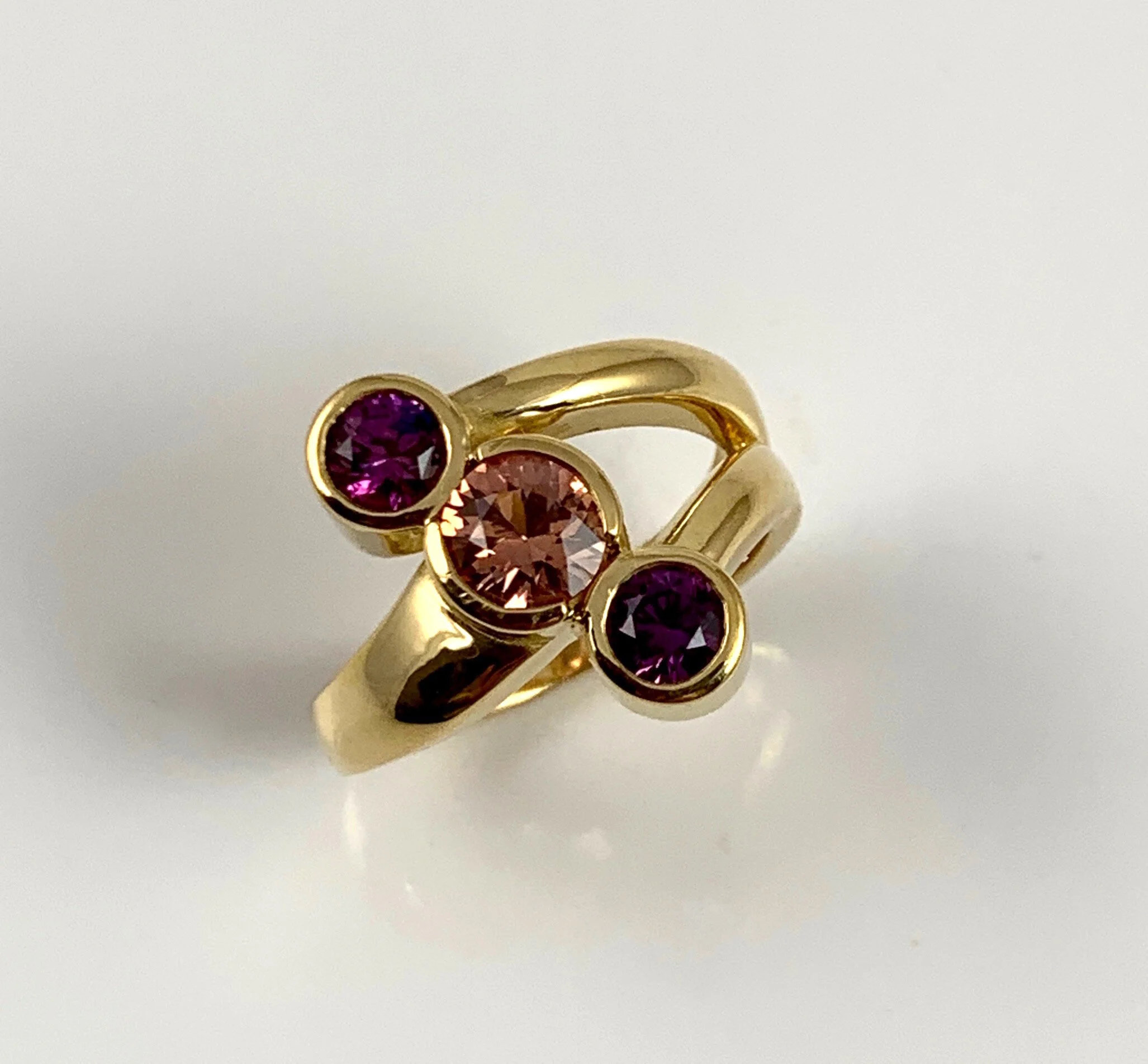 Plums and a Peach sapphires, 2.18ct total in 18K.