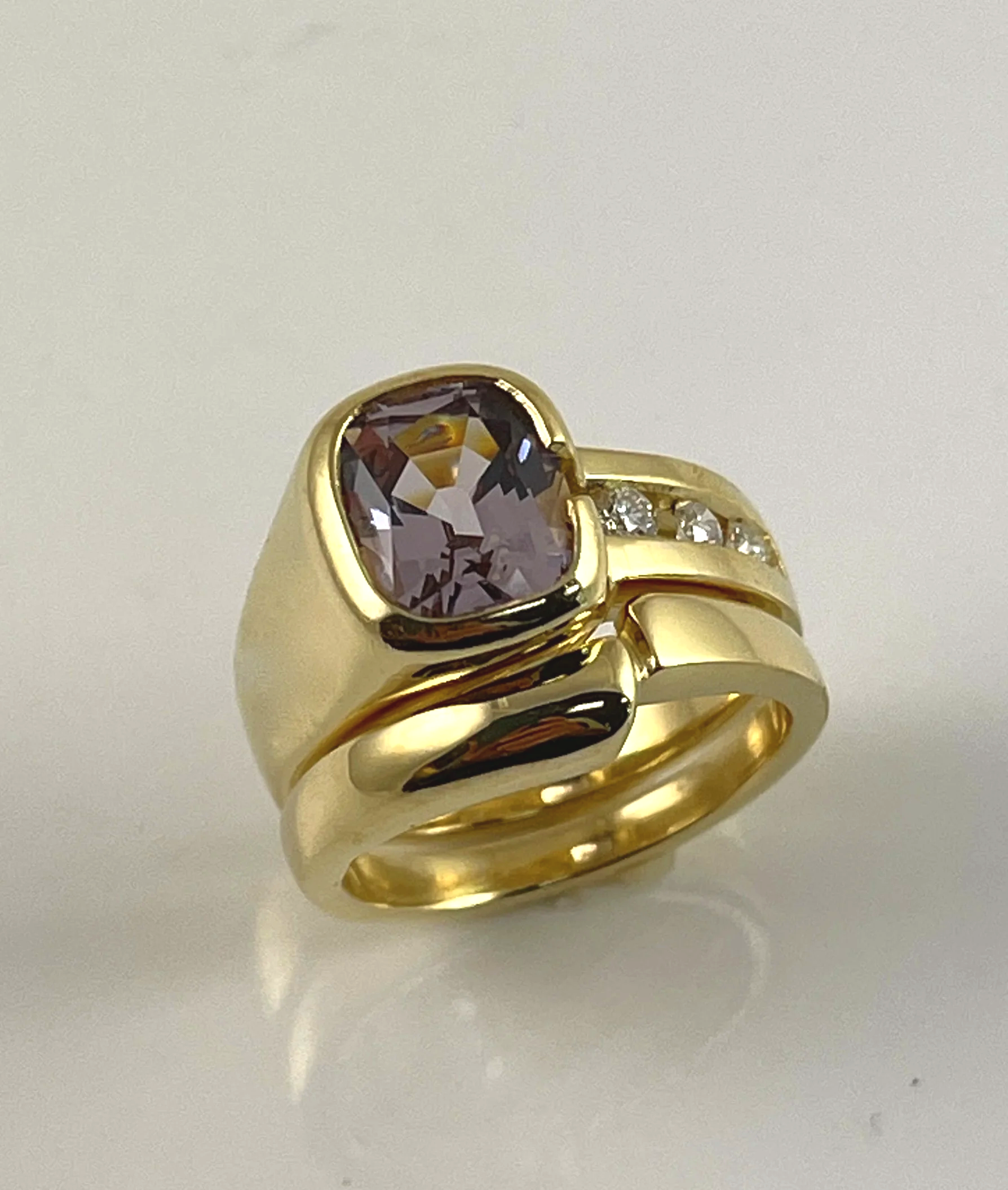 For Cassidy. 18K wedding and engagement ring set, with lavender antique cushion spinel and channel set diamonds.