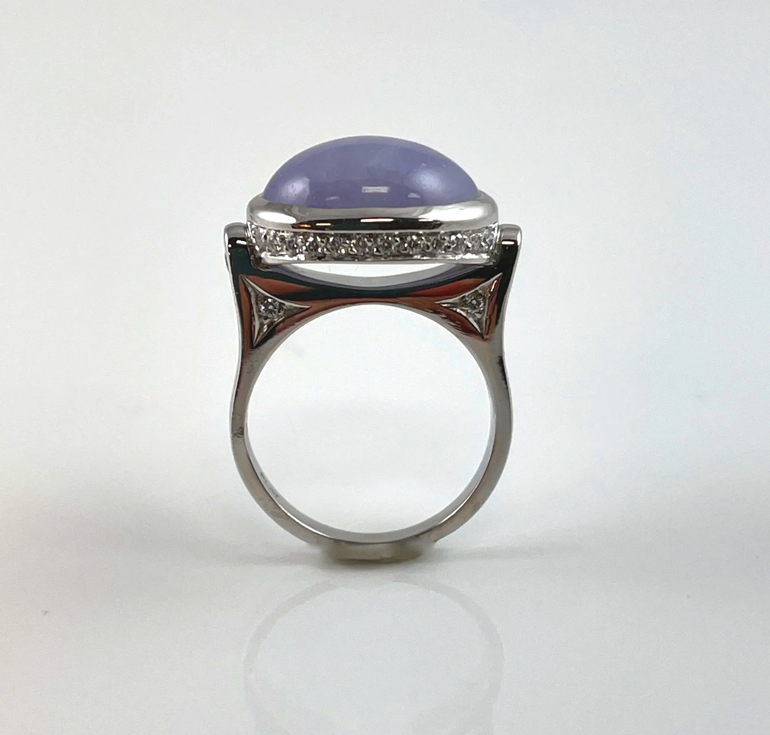 For Mallory. Platinum ring created to hold the lavender jade cabochon. Diamond pave accents the lines.