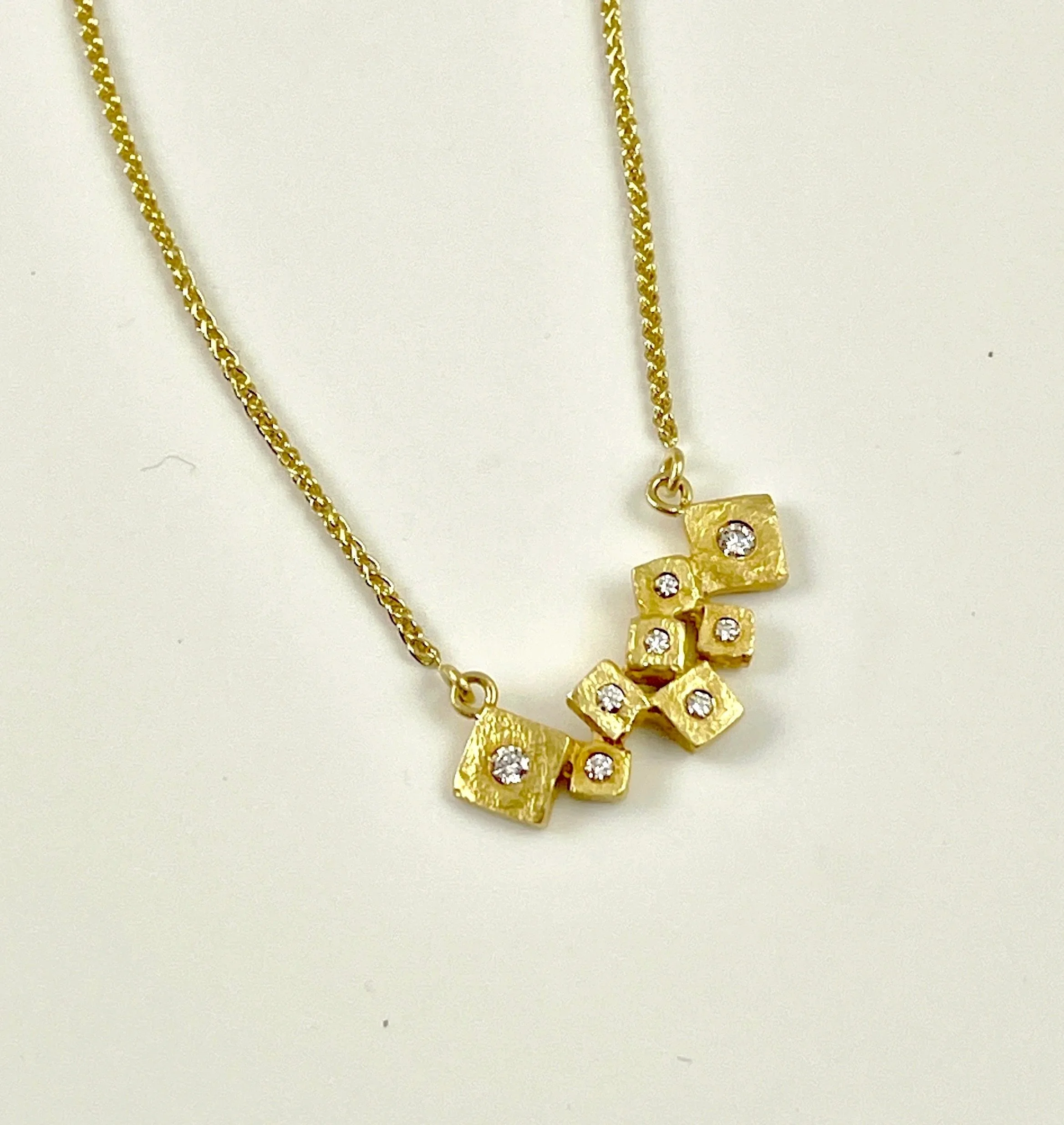 Quarry Necklace set with 0.16ct total weight
VS F diamonds, 1.1mm 18K 16" Wheat Chain.
