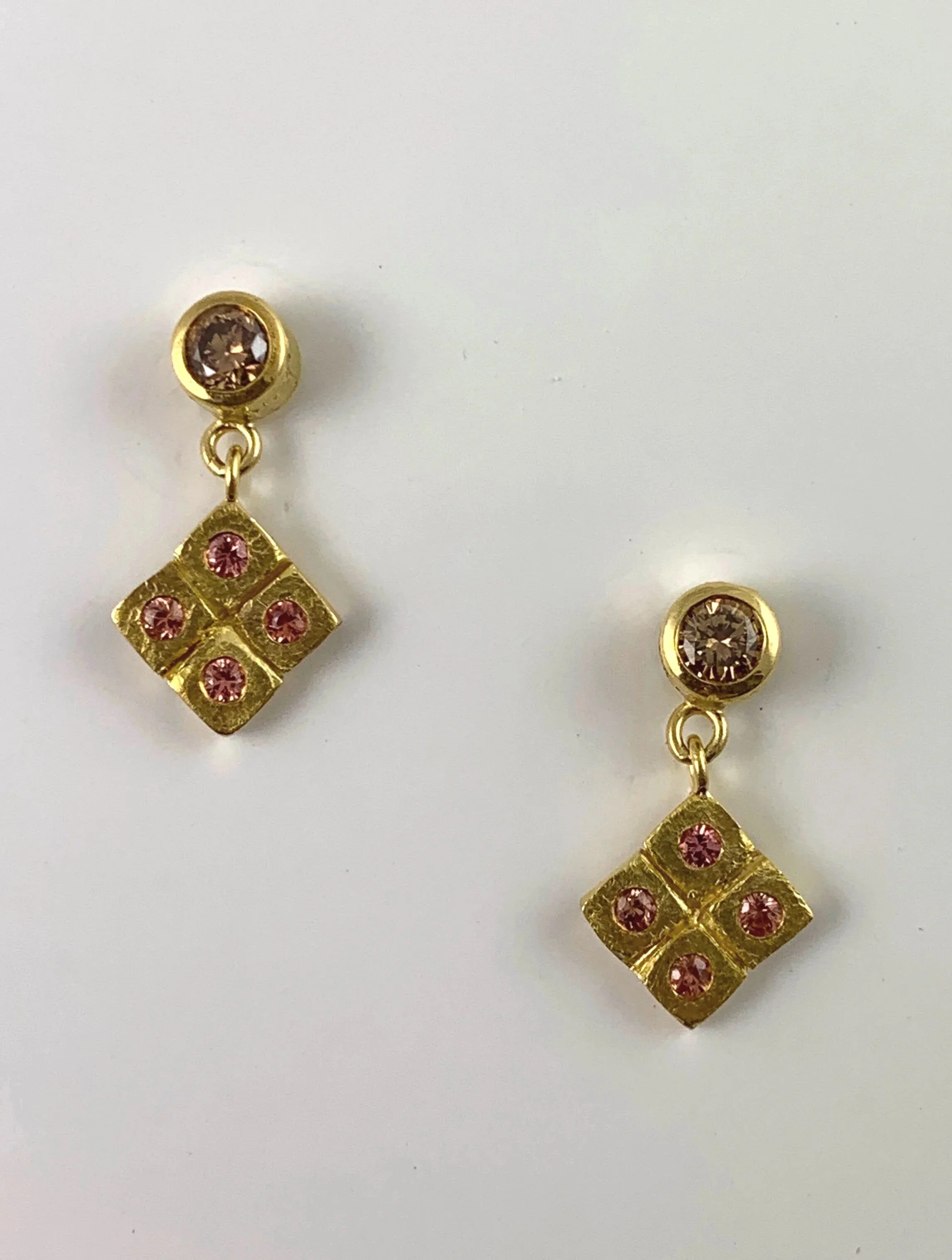 Calm:  Cognac diamonds 0.27ct tw, and peach sapphires, 0.16ct tw. set in 18K.  