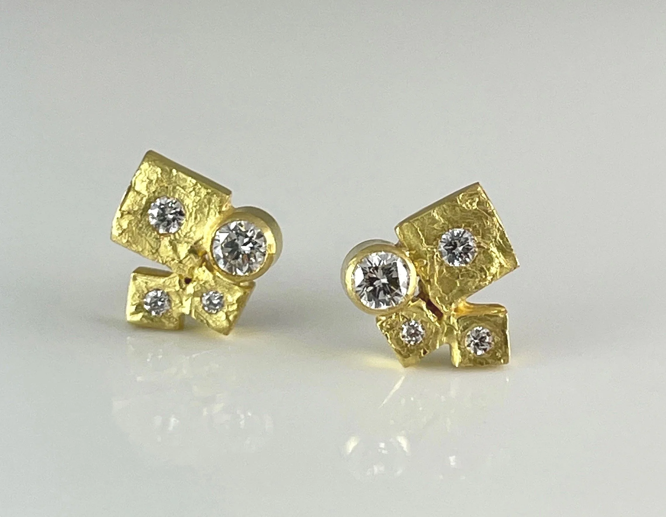 Scintillation:  18K Quarry earrings set with 0.50ct total weight of GVS diamonds.